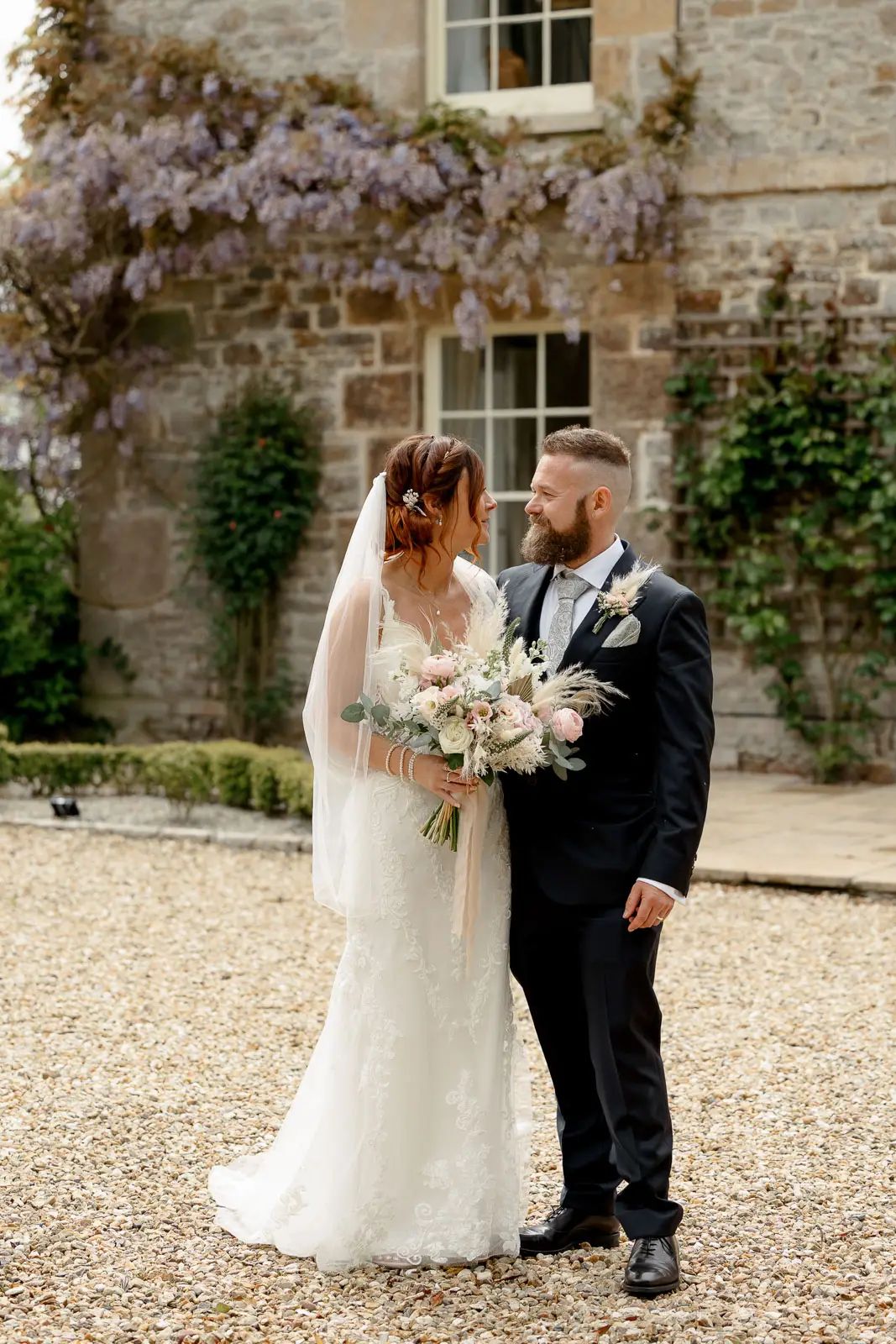 A bride and groom wedding portrait Glebe Barn Devon at Glebe Barn in Devon.