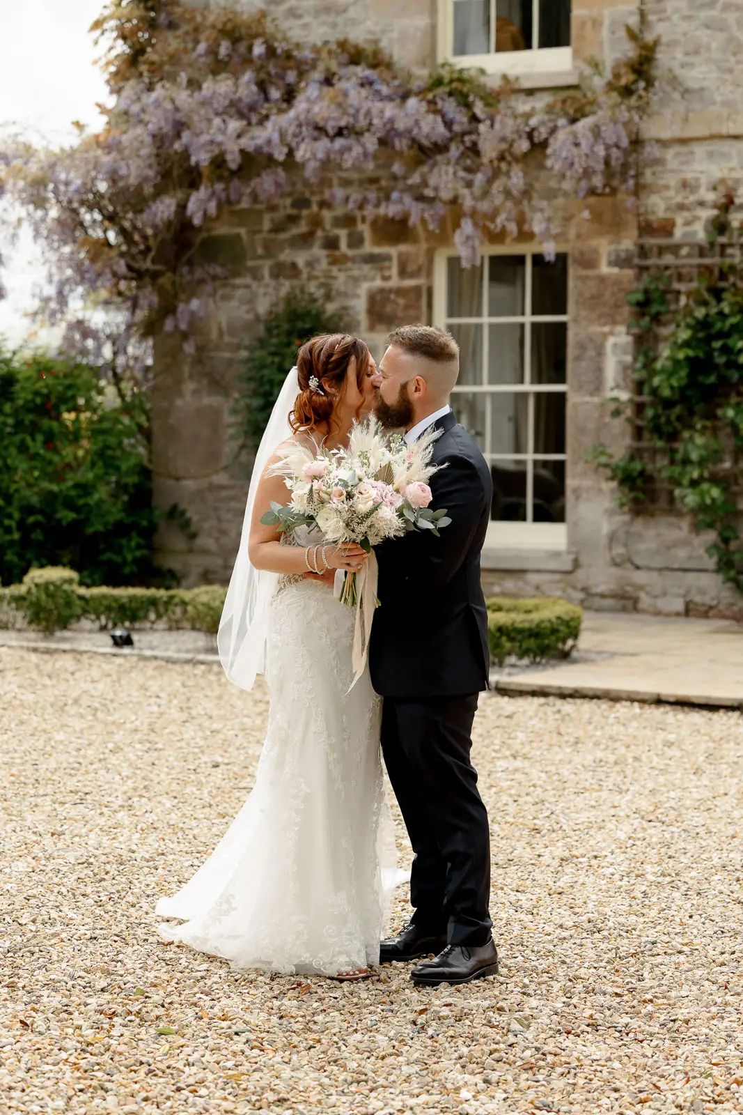 A bride and groom romantic wedding portrait at Glebe Barn in Devon.