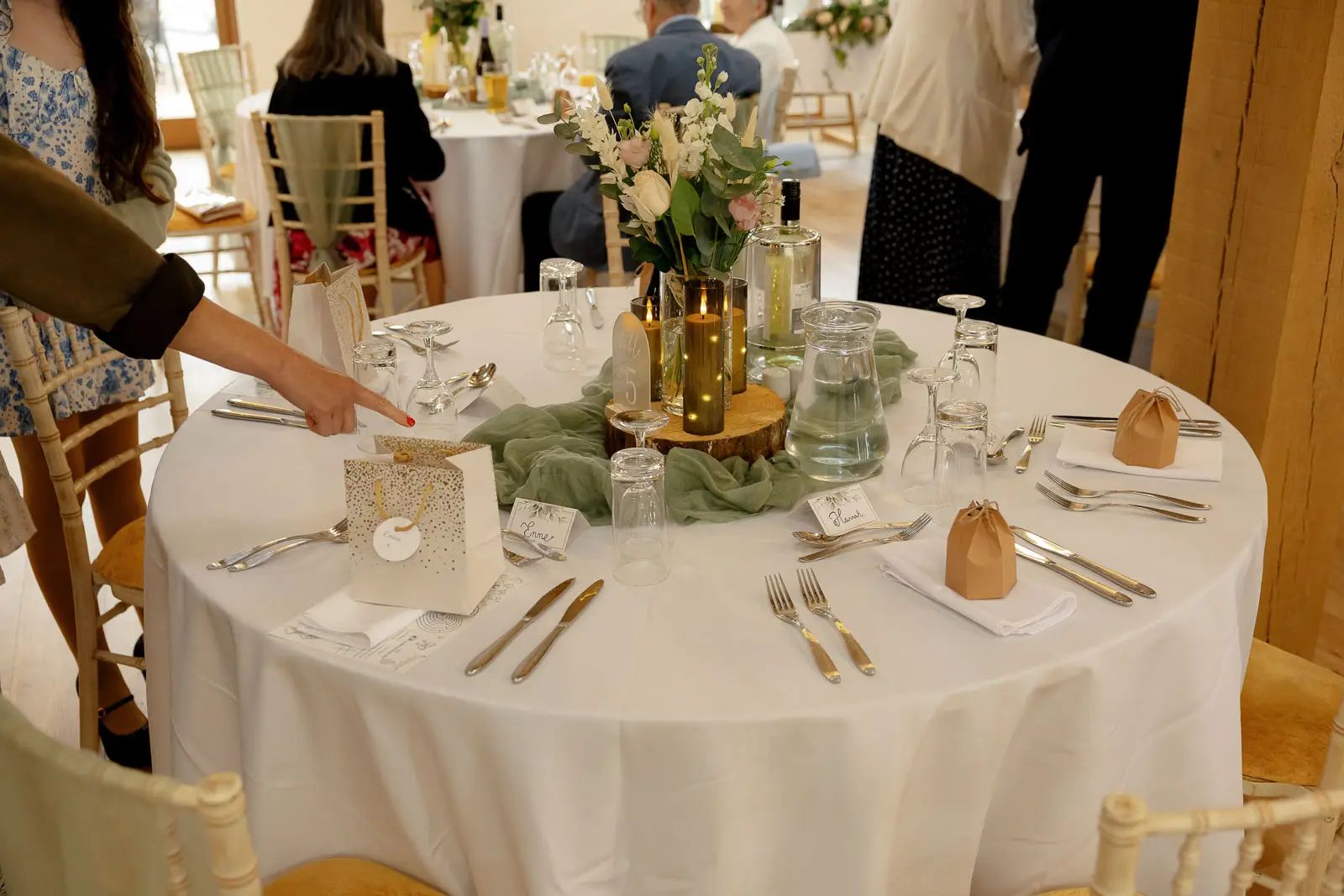 A wedding reception table decorations at Glebe Barn in Devon.