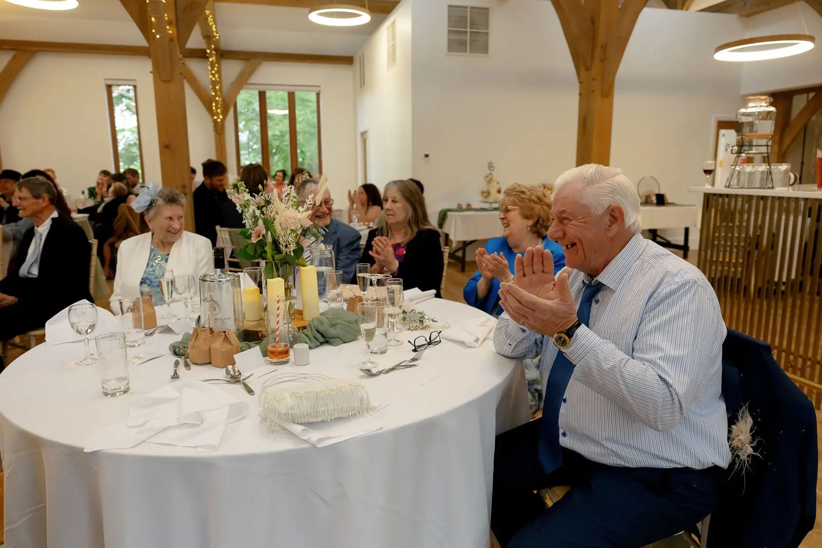 A wedding guests enjoying wedding breakfast at Glebe Barn in Devon.