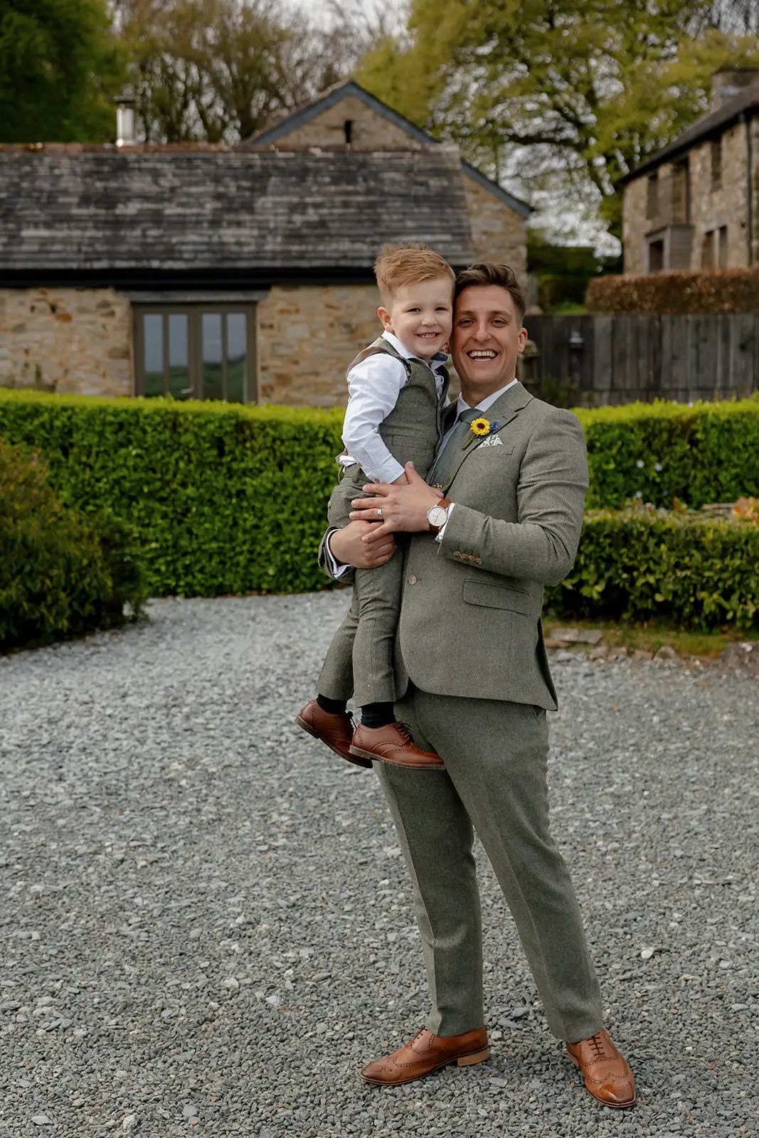 Groom portrait with his son during a wedding at Trevenna