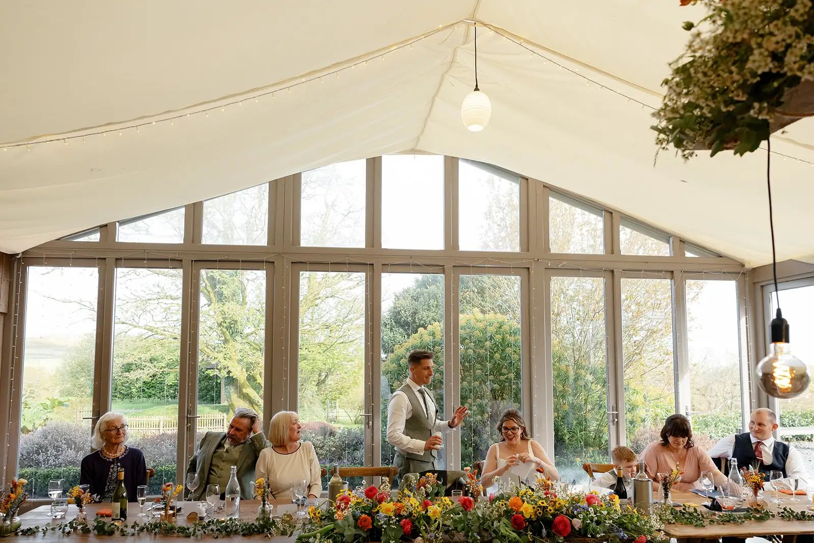 Guests celebrating at a wedding reception at Trevenna