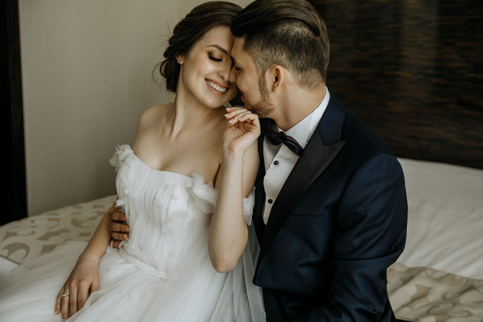 An elegant, unposed couple portrait in an urban setting, by a wedding photographer, Tanya Bogdan.