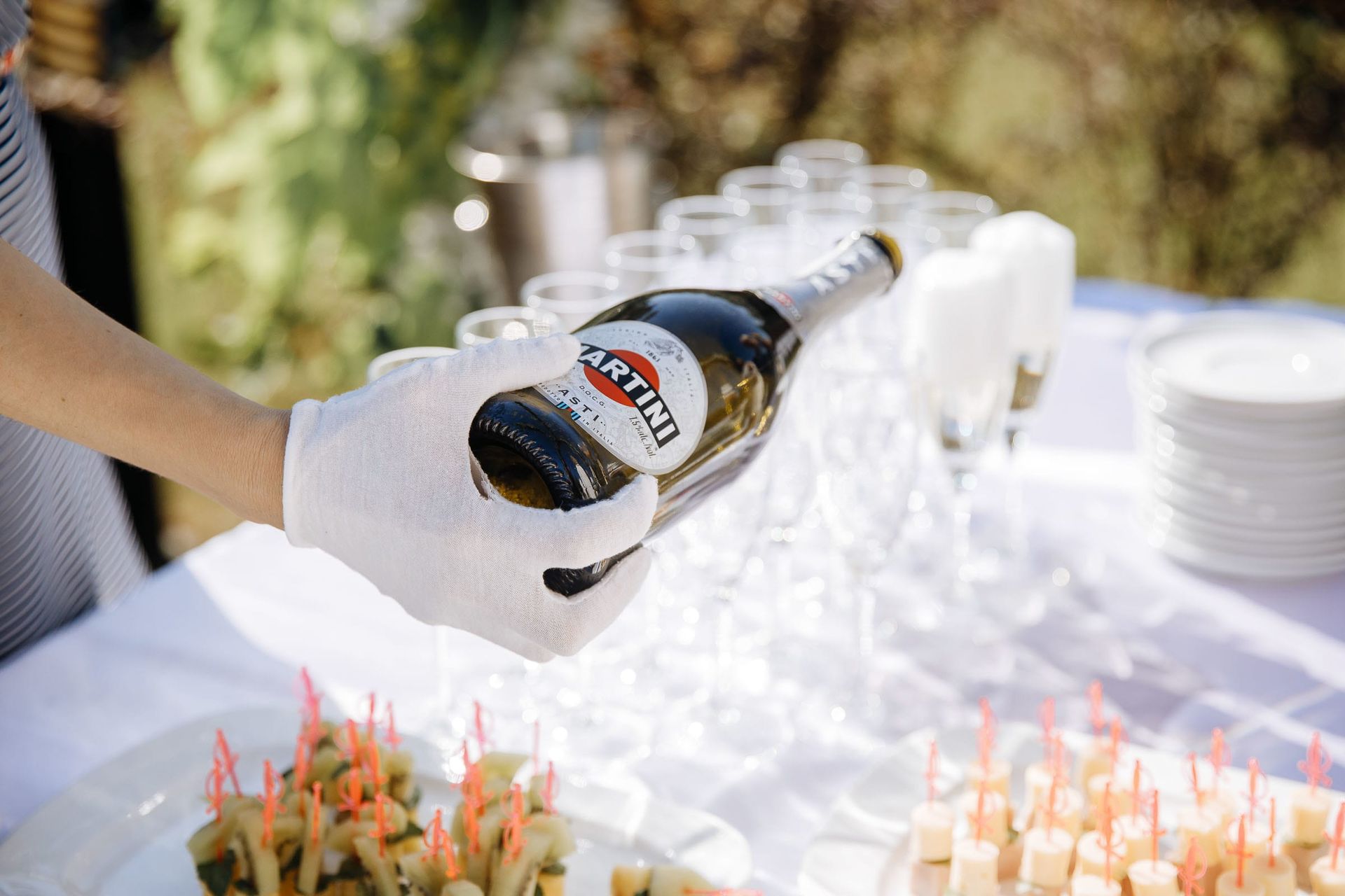 Close-up detail of a Martini being poured at a luxury wedding.
