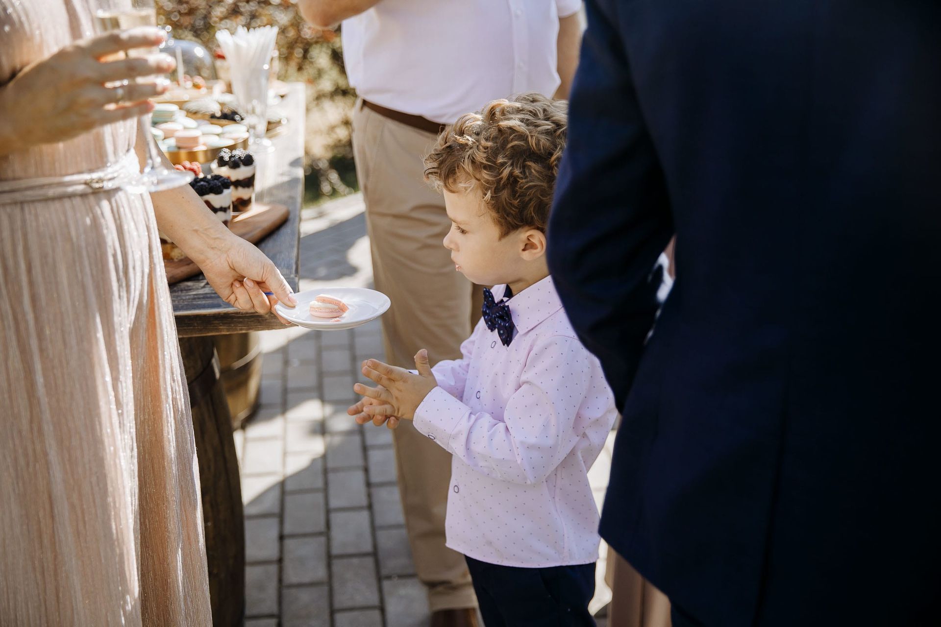 Candid shot of a young page boy before the wedding ceremony.