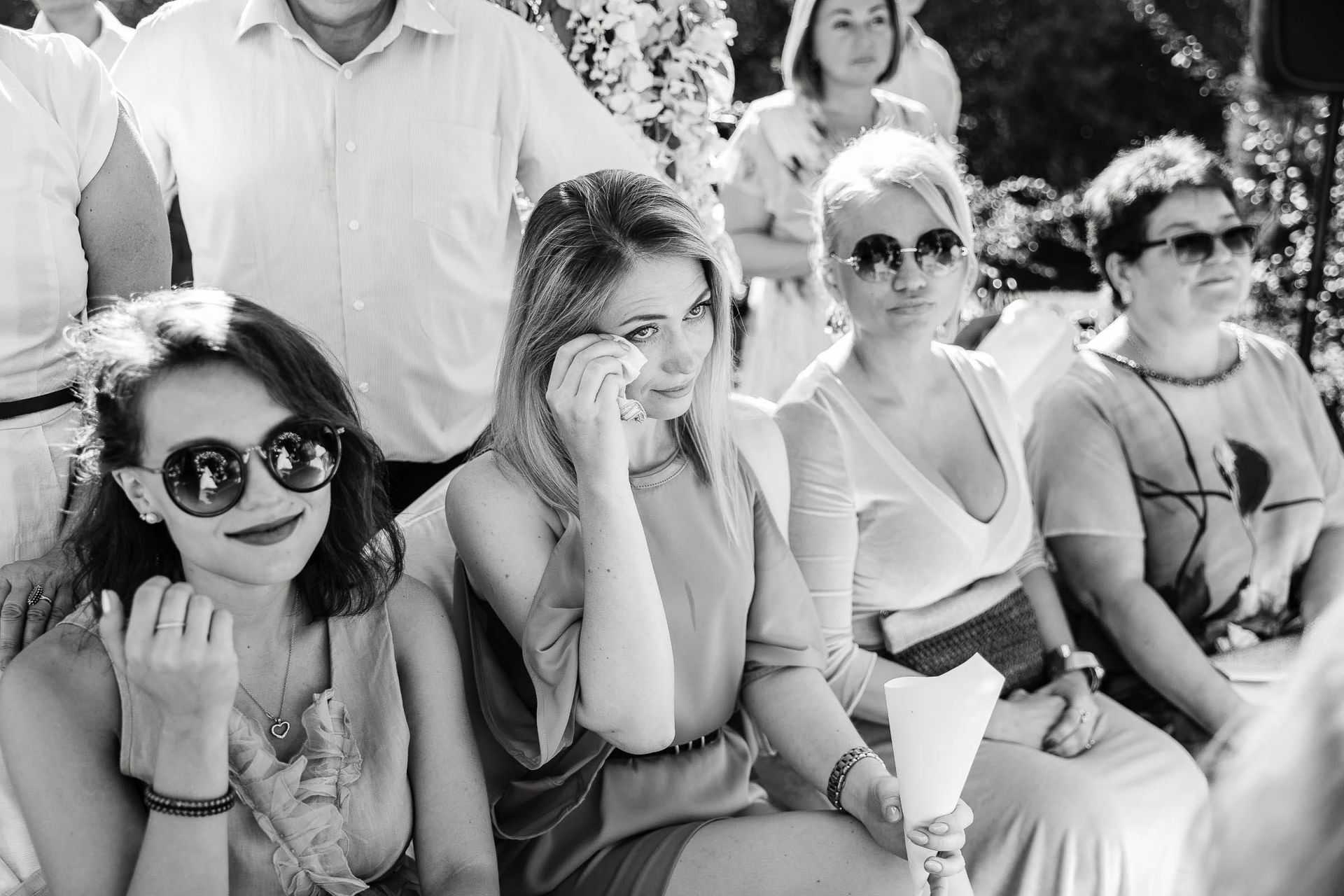 Emotional reaction of guests during a wedding ceremony.