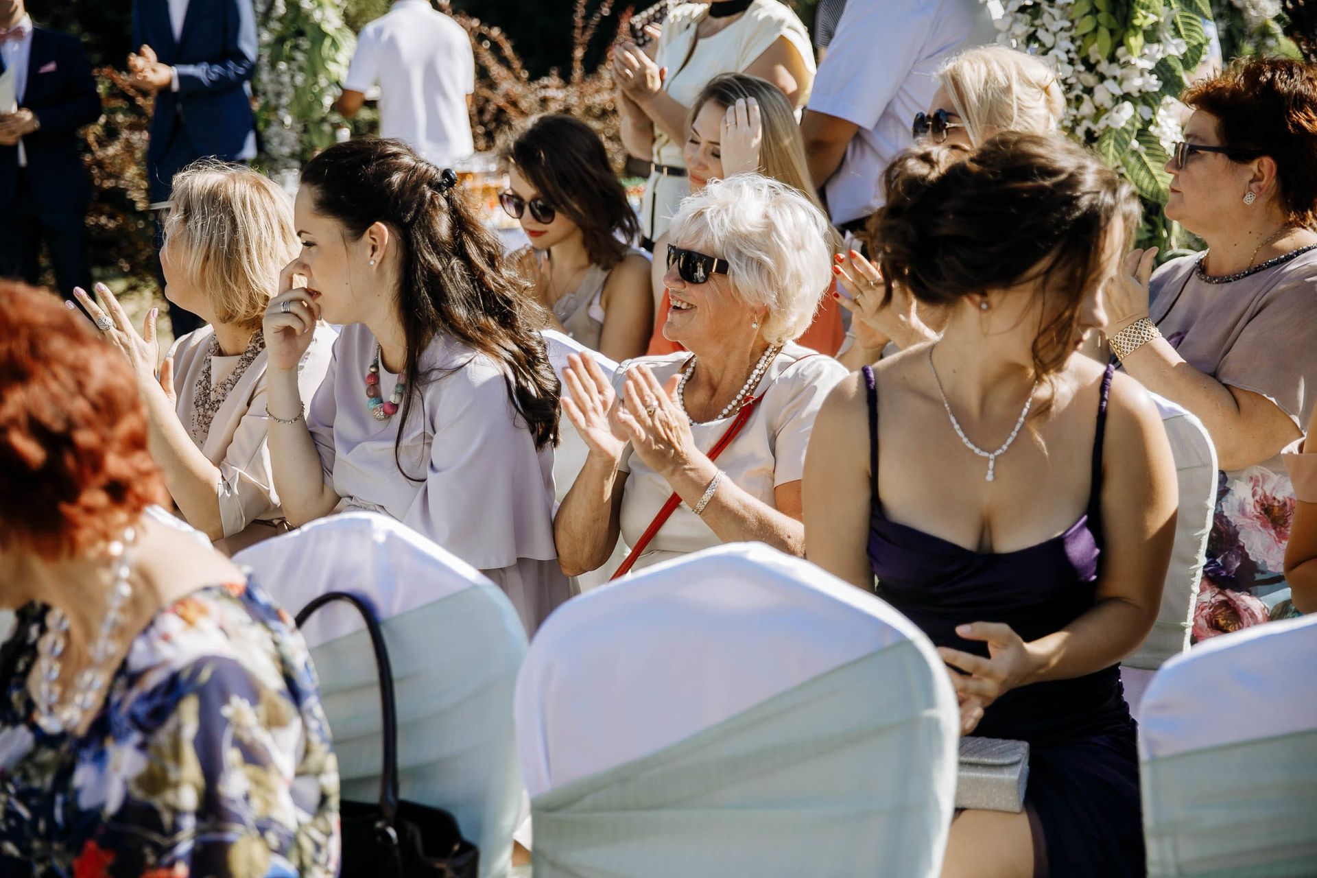 Documentary photography capturing the atmosphere of an outdoor wedding.