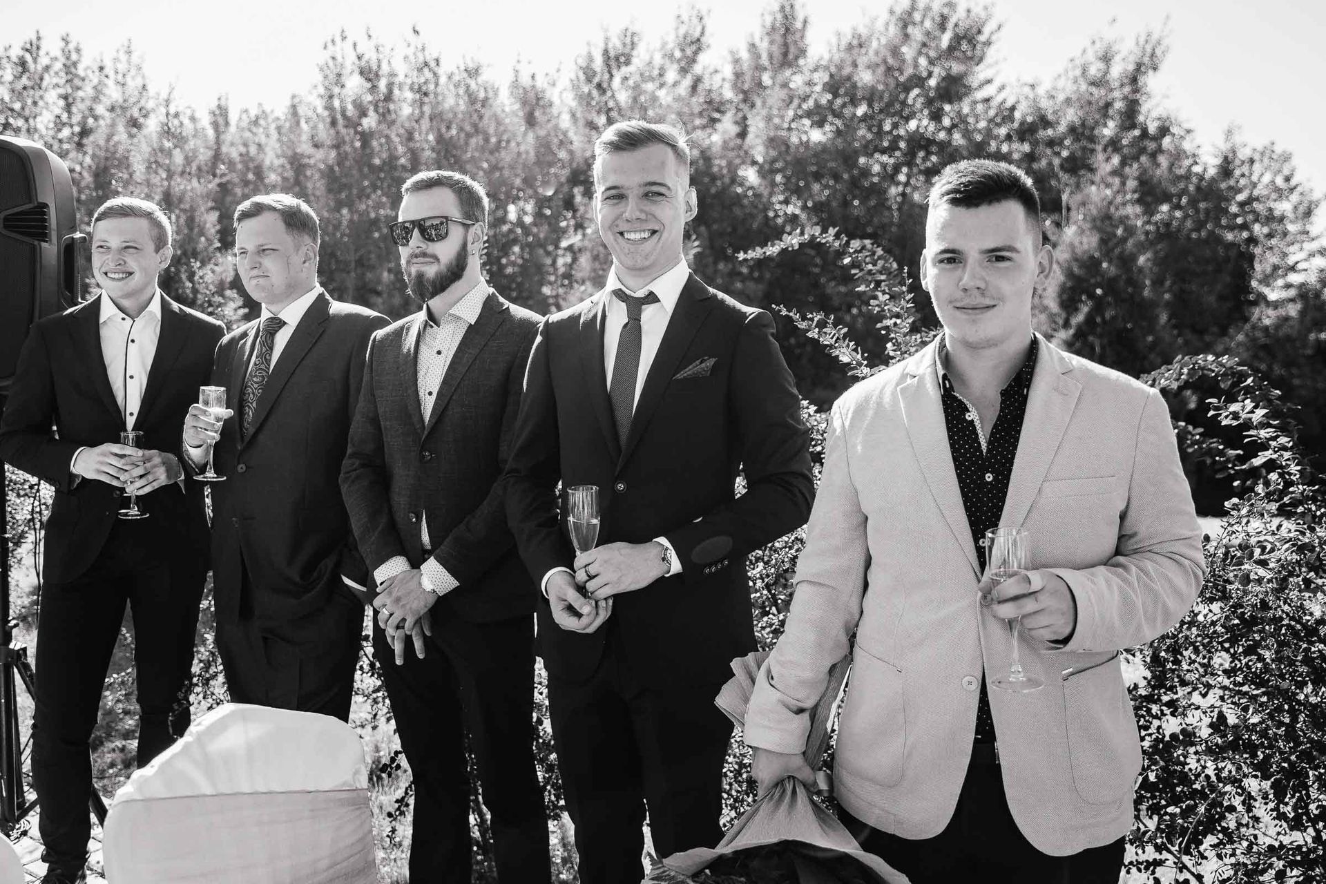 Candid shot of the groomsmen celebrating after the ceremony.
