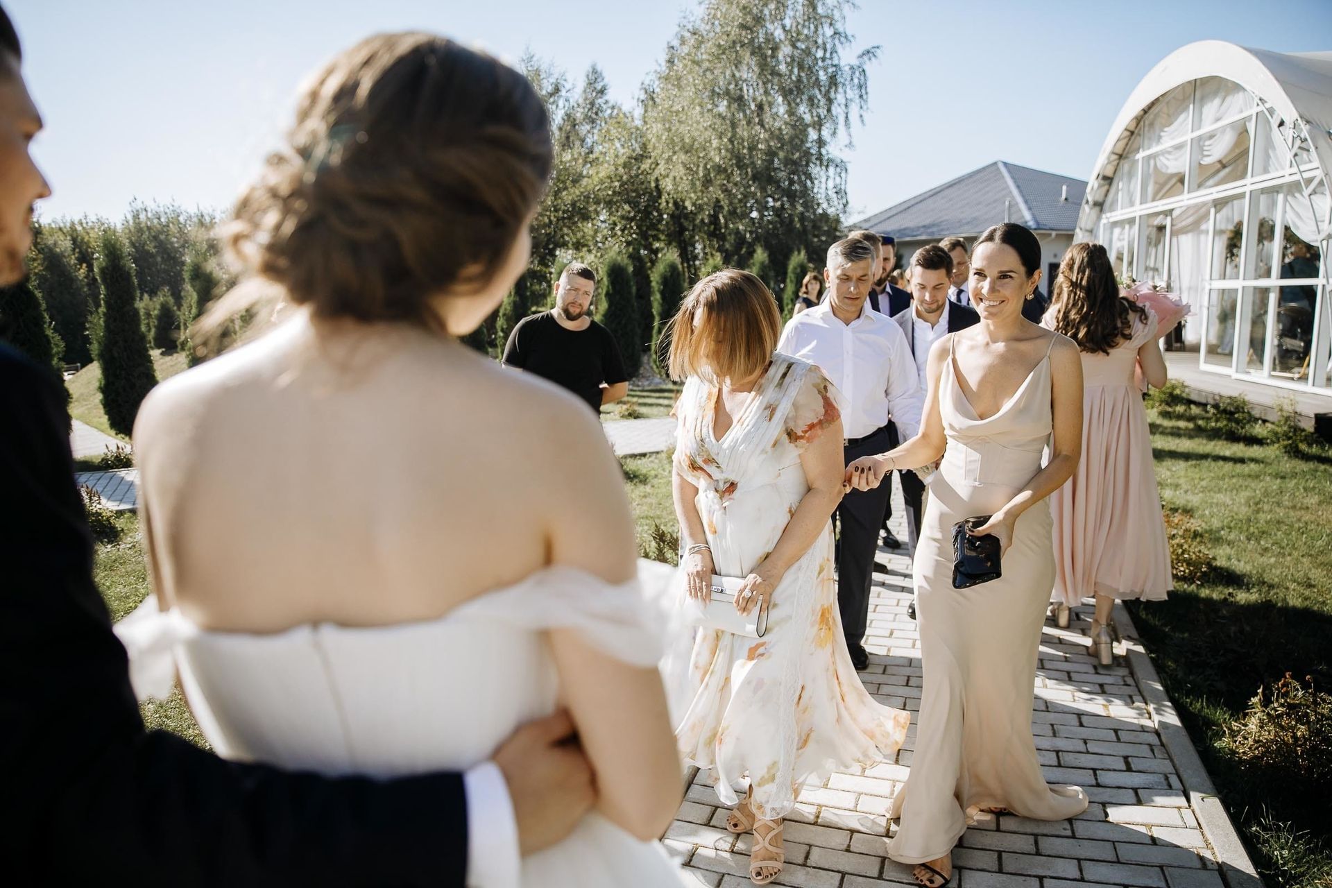 Candid celebration moments at an outdoor wedding in the South West, by a South West wedding photographer, Tanya Bogdan.