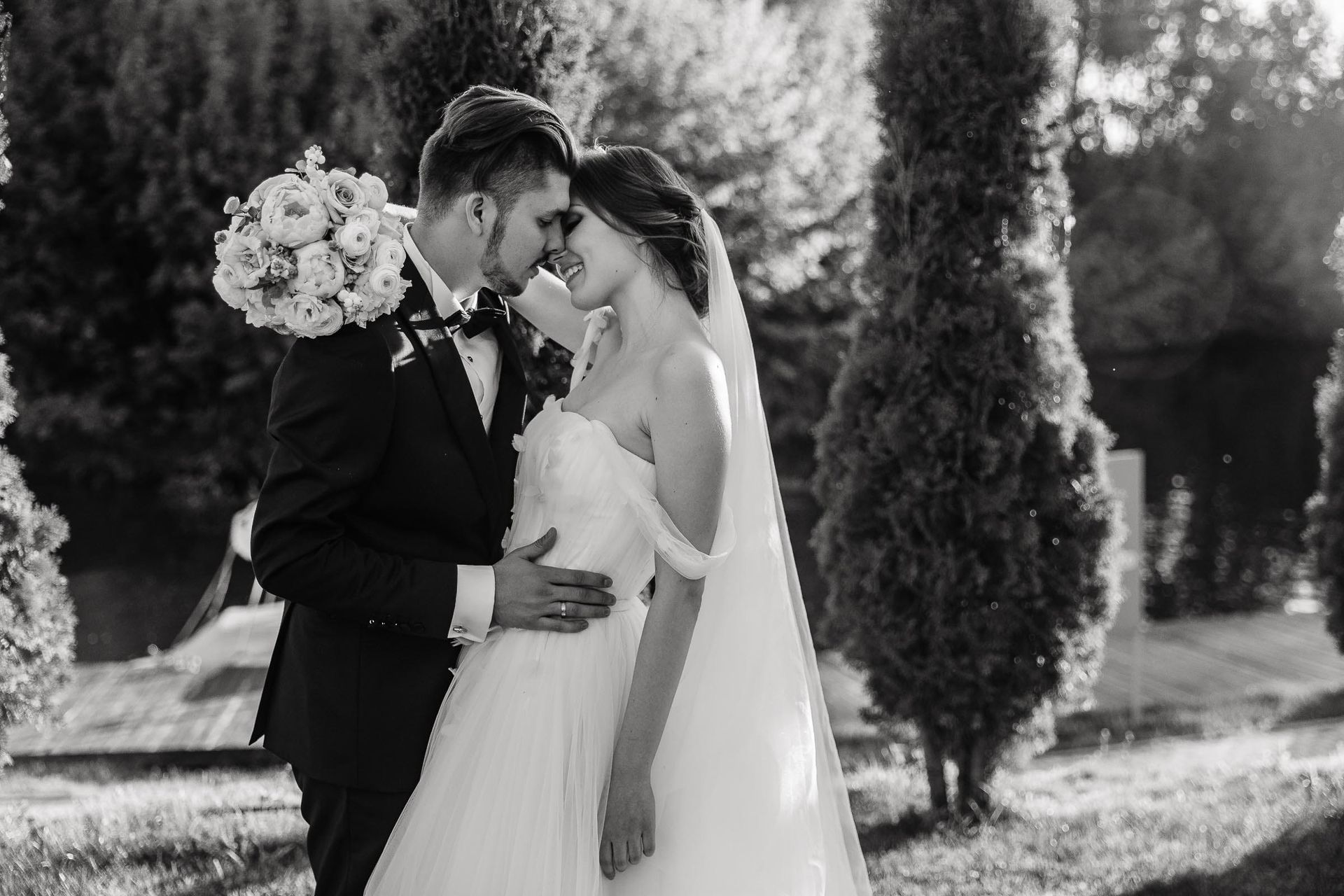 Romantic couple portrait in a lush garden setting, by a London wedding photographer, Tanya Bogdan.