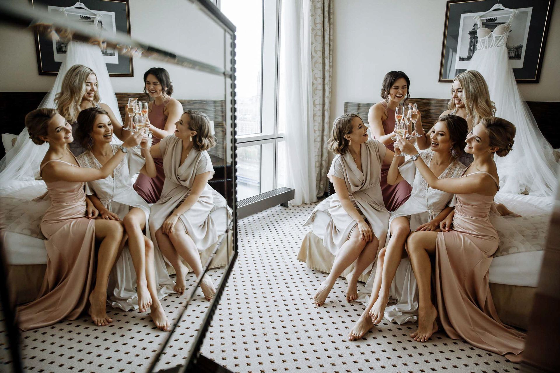 Elegant fine art style bridal party portrait with reflection in the mirror by Cornwall wedding photographer Tanya Bogdan Photography.