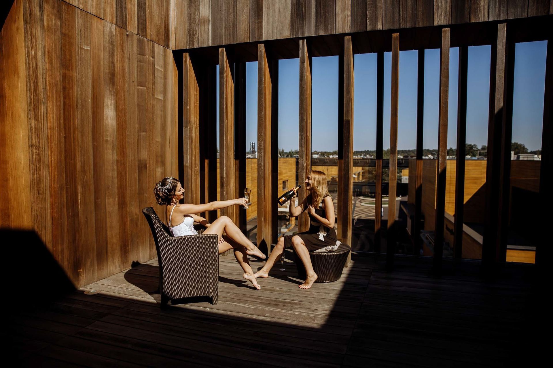 Candid moment of a bride and her bridesmaid by Bude wedding photographer Tanya Bogdan.