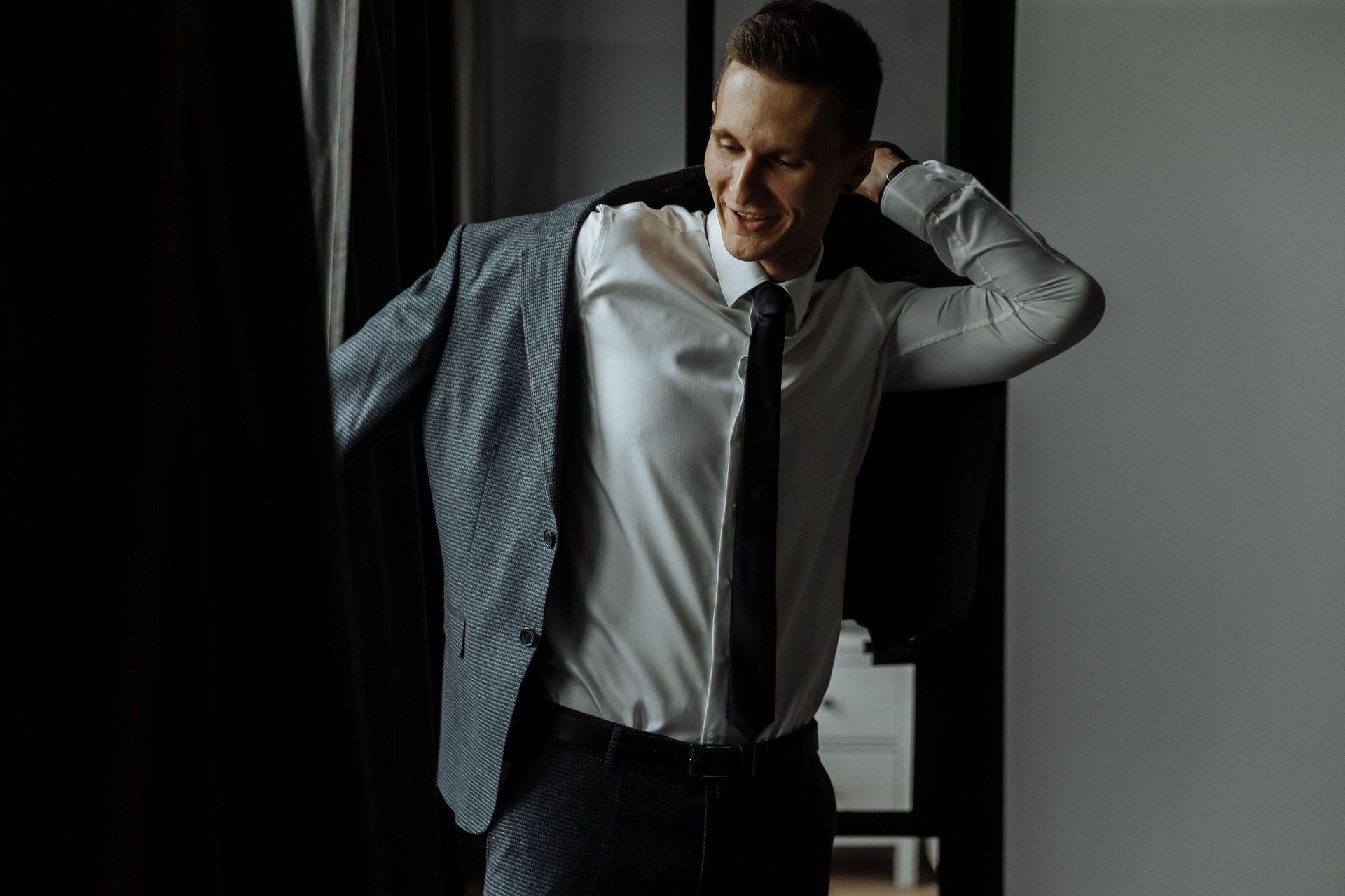 Candid groom preparation shots from a professional Devon wedding photographer.