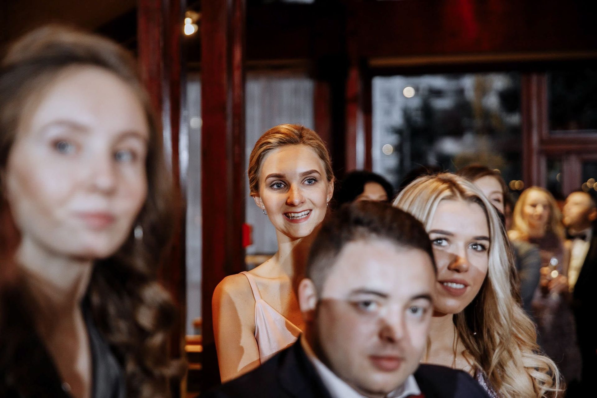Heartfelt ceremony moment of guests watching bride walk the aisele; Tanya Bogdan documentary wedding photography.
