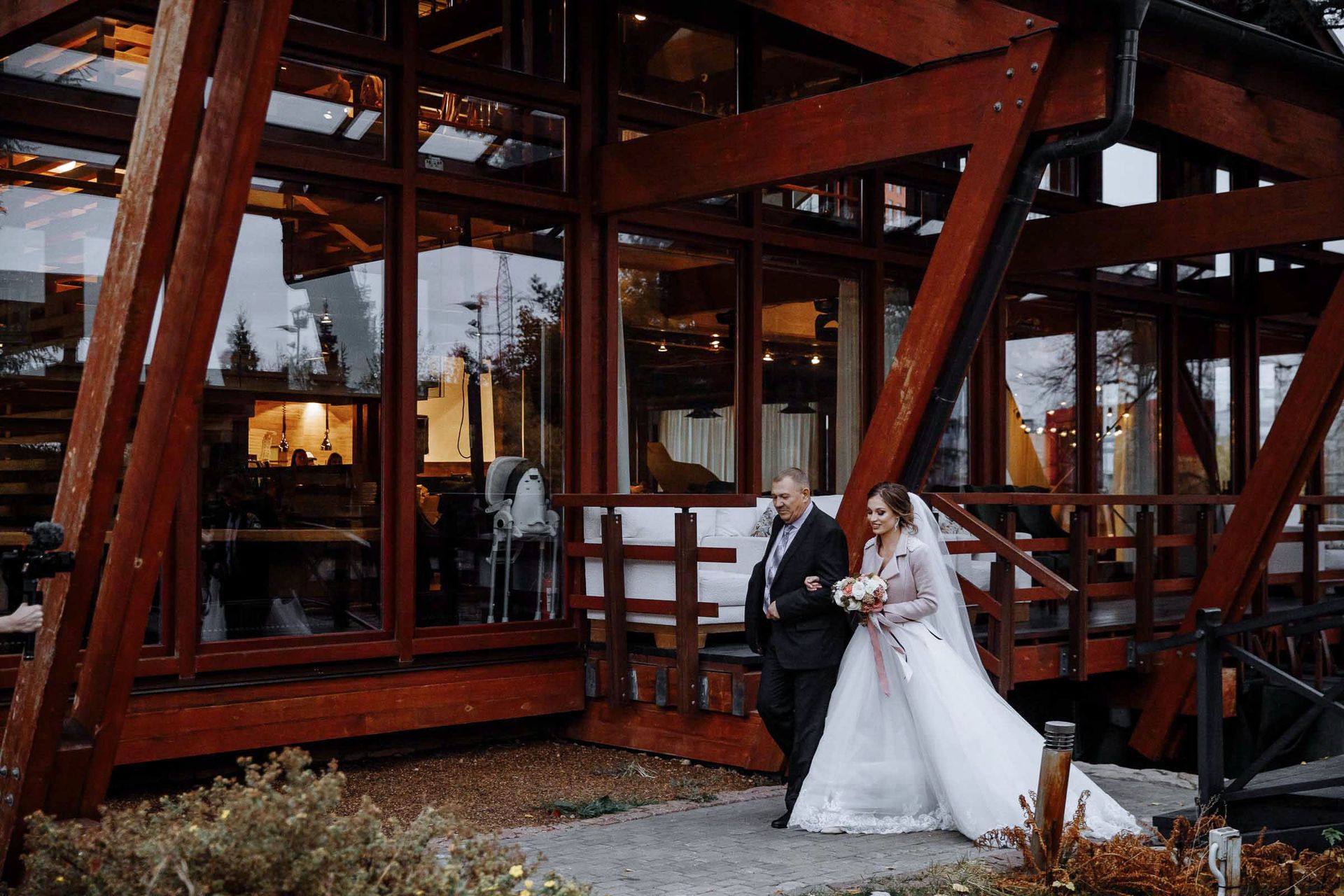 Father of the bride walking his daughter down the aisle, by Cornwall wedding photographer Tanya Bogdan