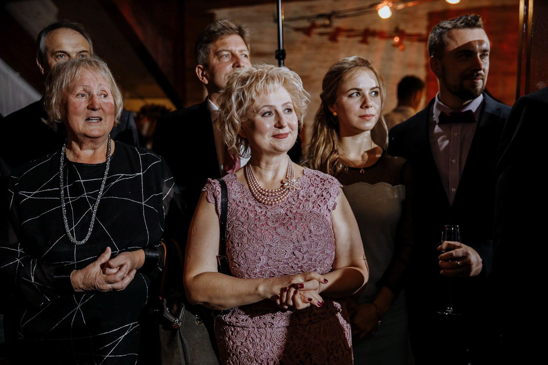 Close-up of guests during a wedding ceremony.