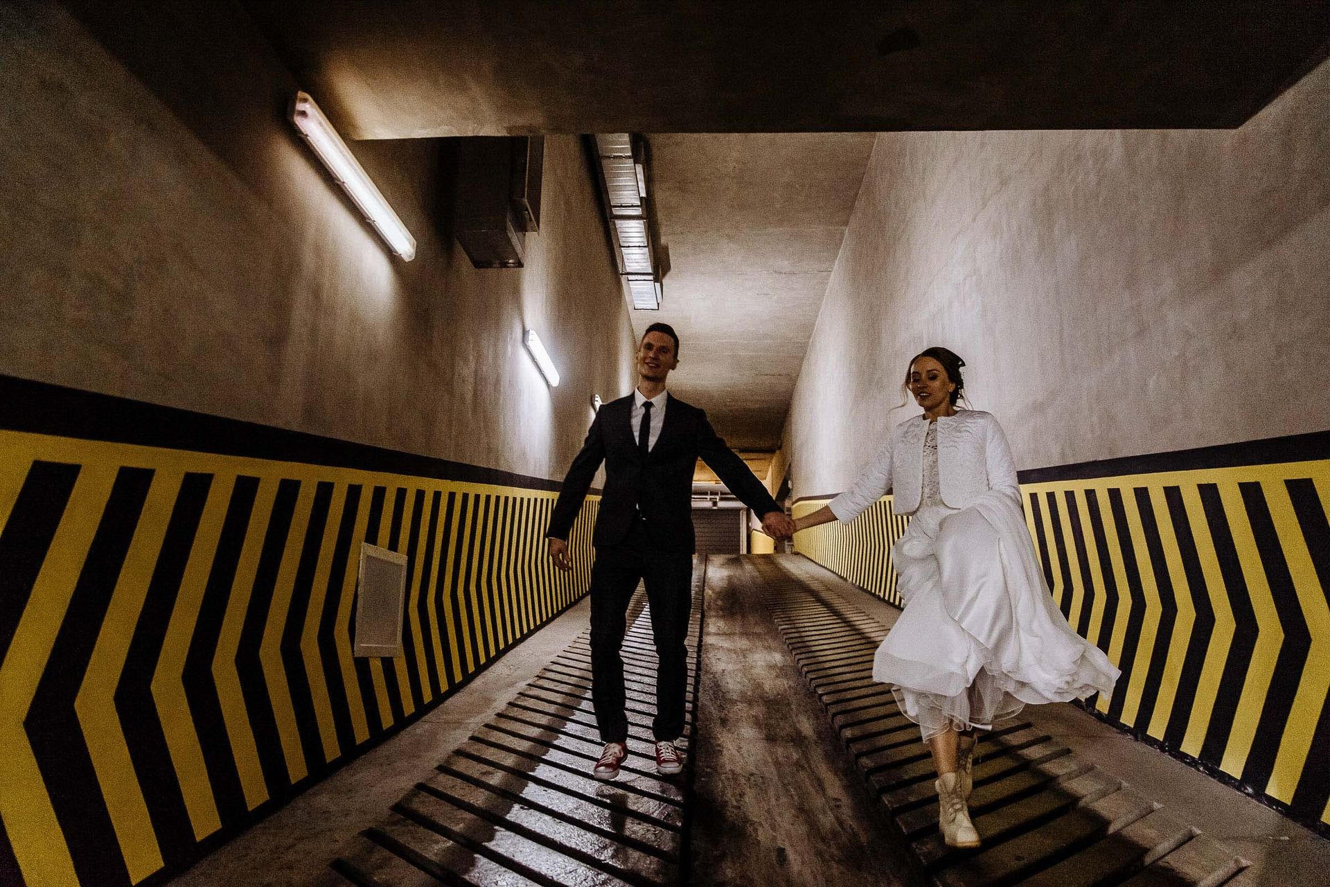 Editorial urban wedding portrait in car park by Tanya Bogdan.