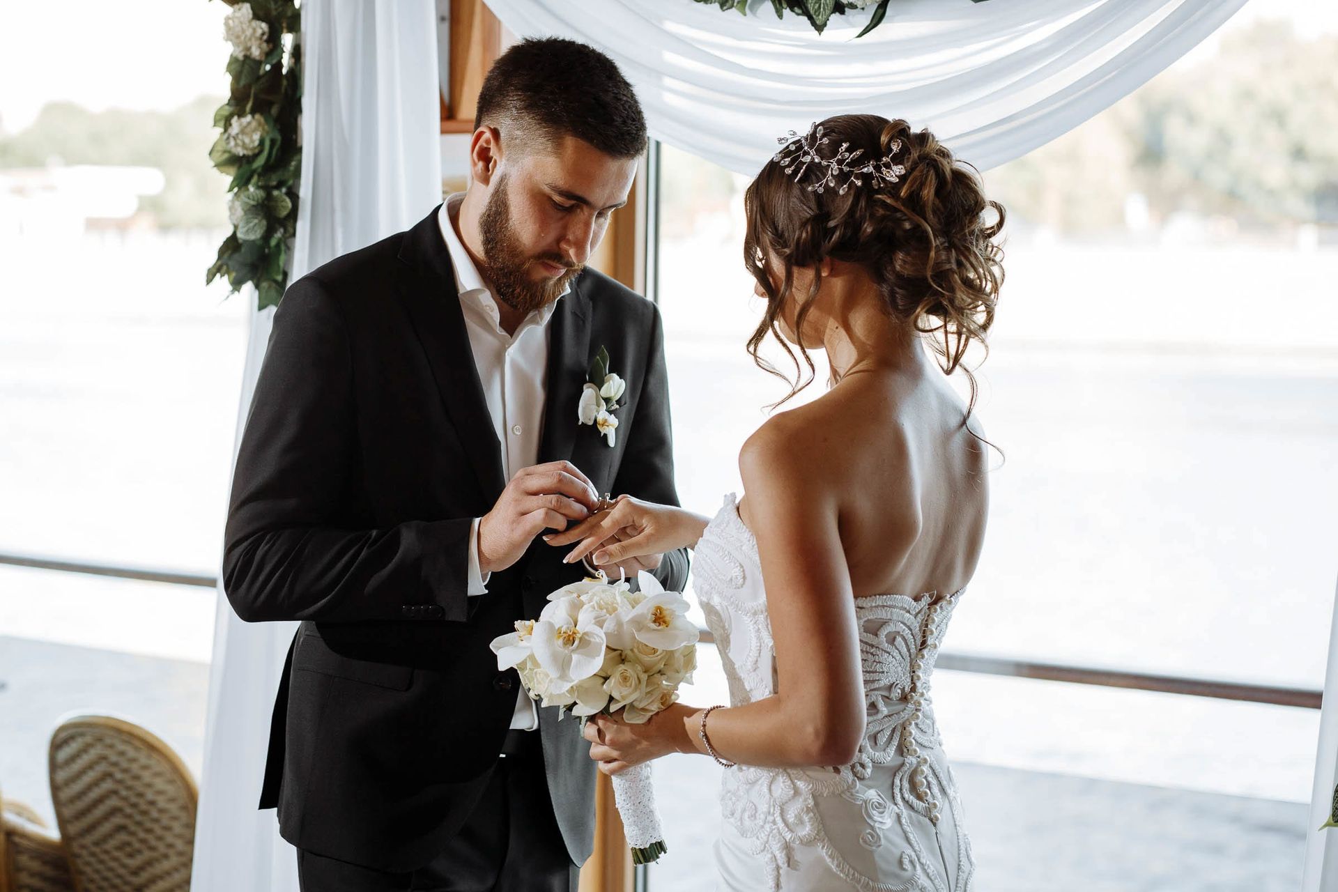 Close-up of exchanging rings captured by Devon wedding photographer Tanya Bogdan.