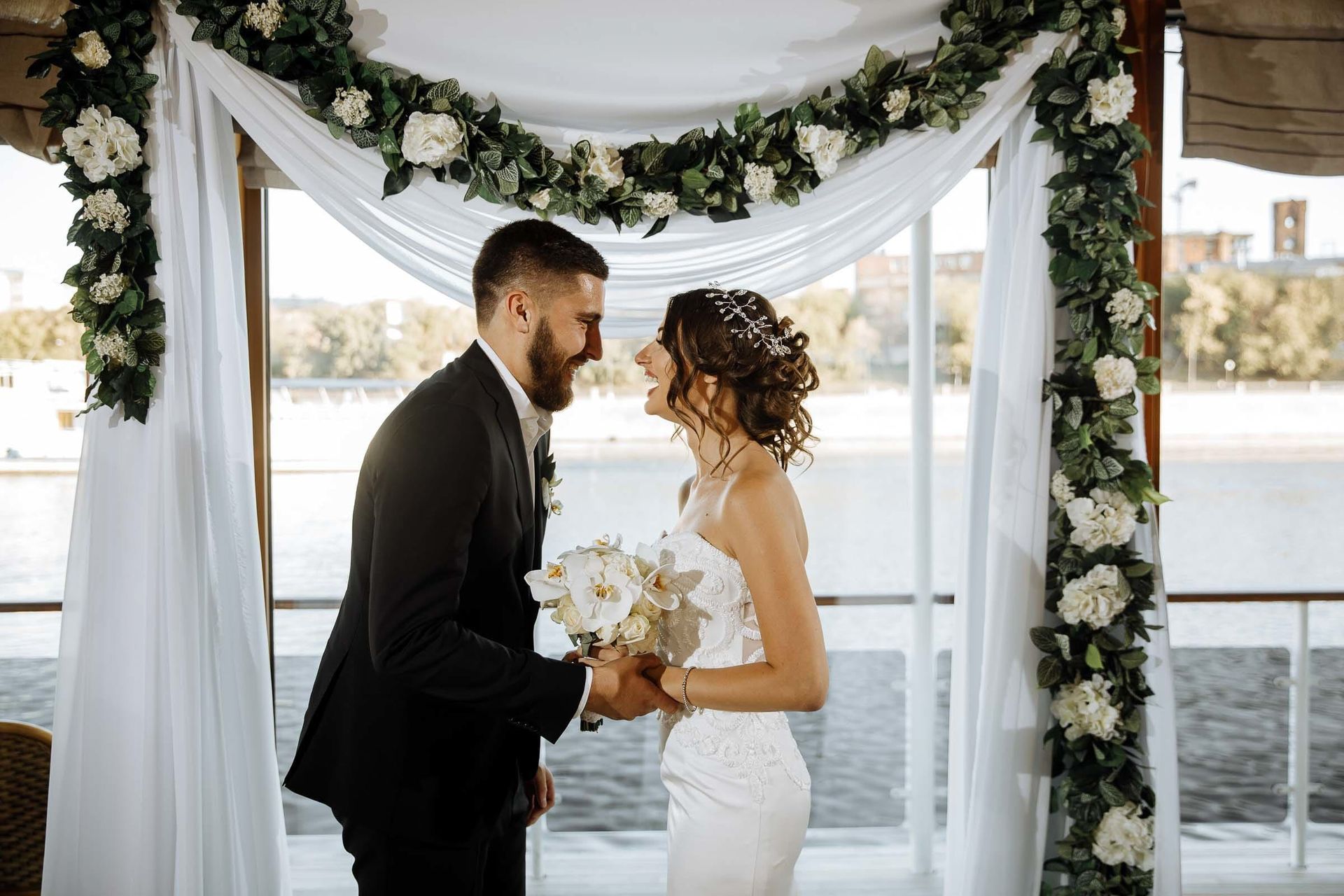 Bride and groom laughing at ceremony, captured by Cornwall wedding photographer Tanya Bogdan.