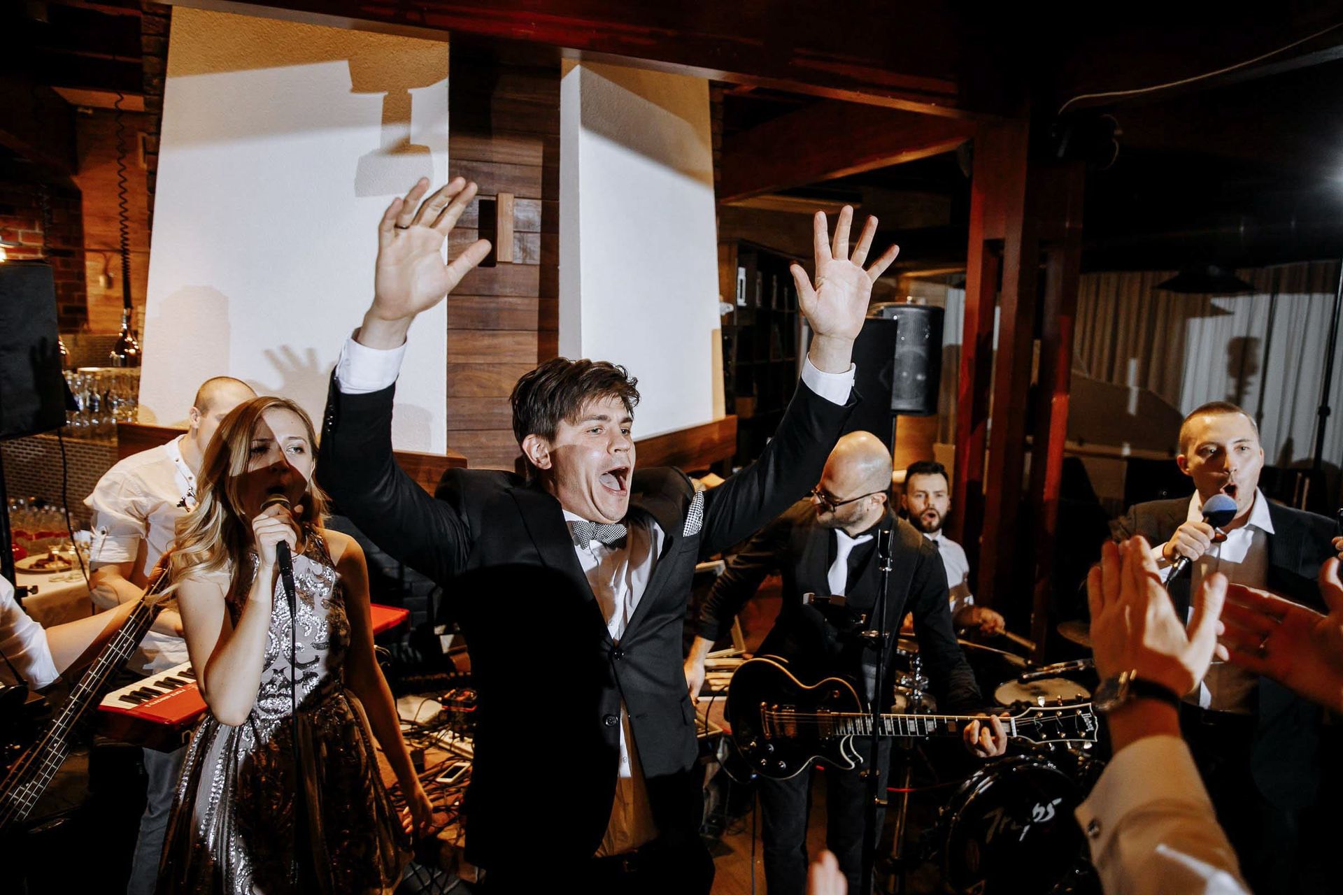 Energetic dancing and party atmosphere on the wedding dancefloor.