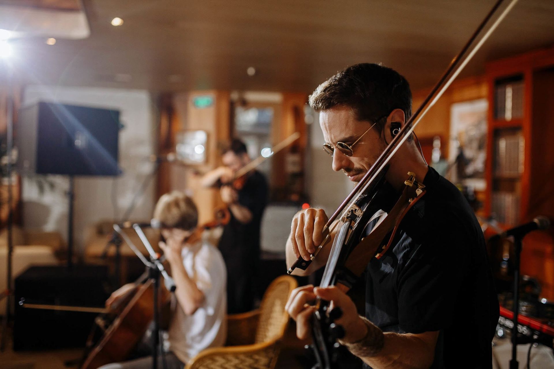 Documentary photography of violinist by Devon wedding photographer Tanya Bogdan.