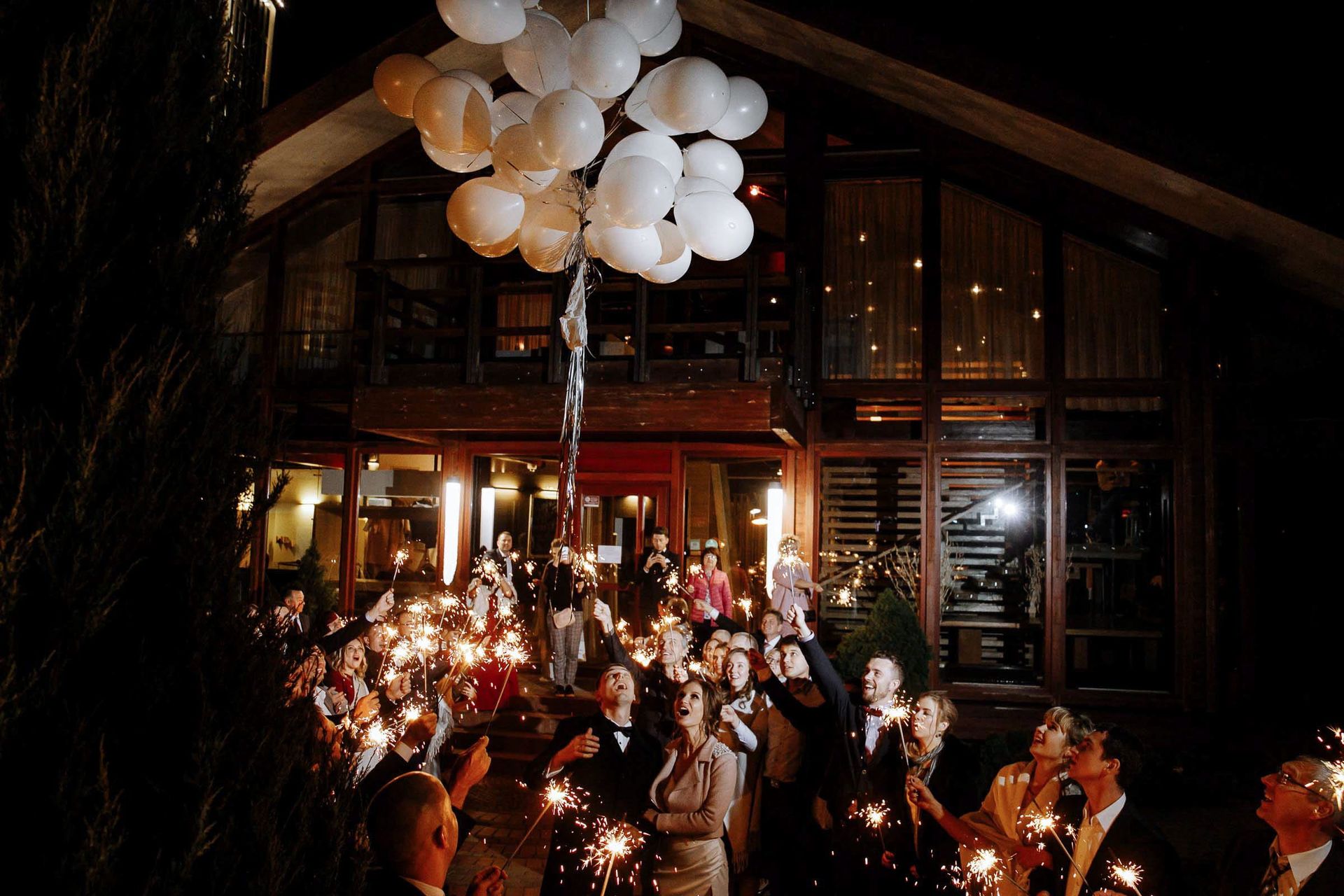 Guests emotion at letting go of the balloons at the end of the reception, by Cornwall wedding photographer Tanya Bogdan.