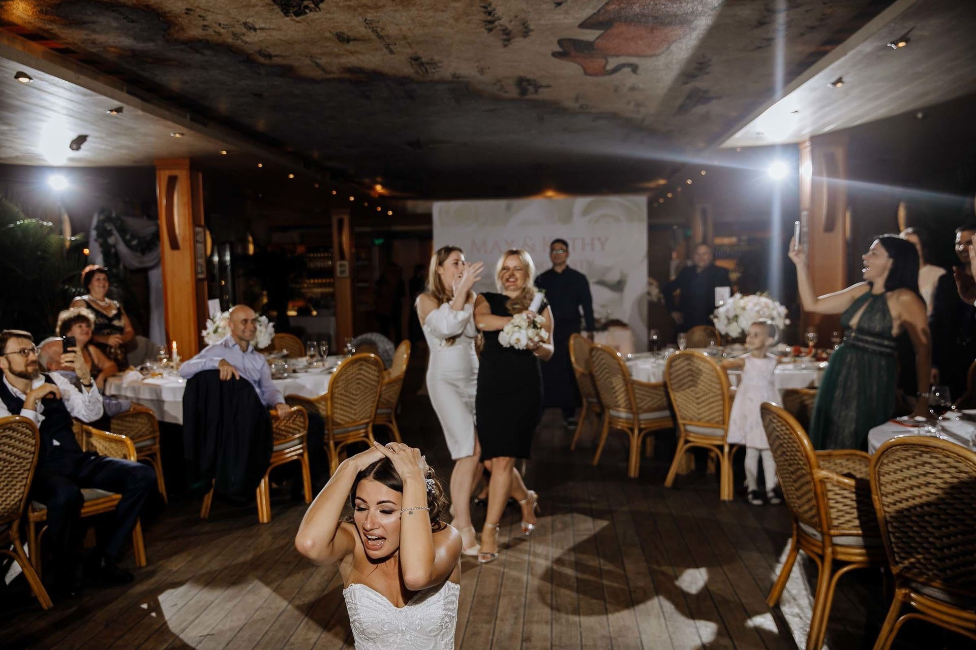 Tanya Bogdan | Fun and candid documentary photography of the bouquet toss.