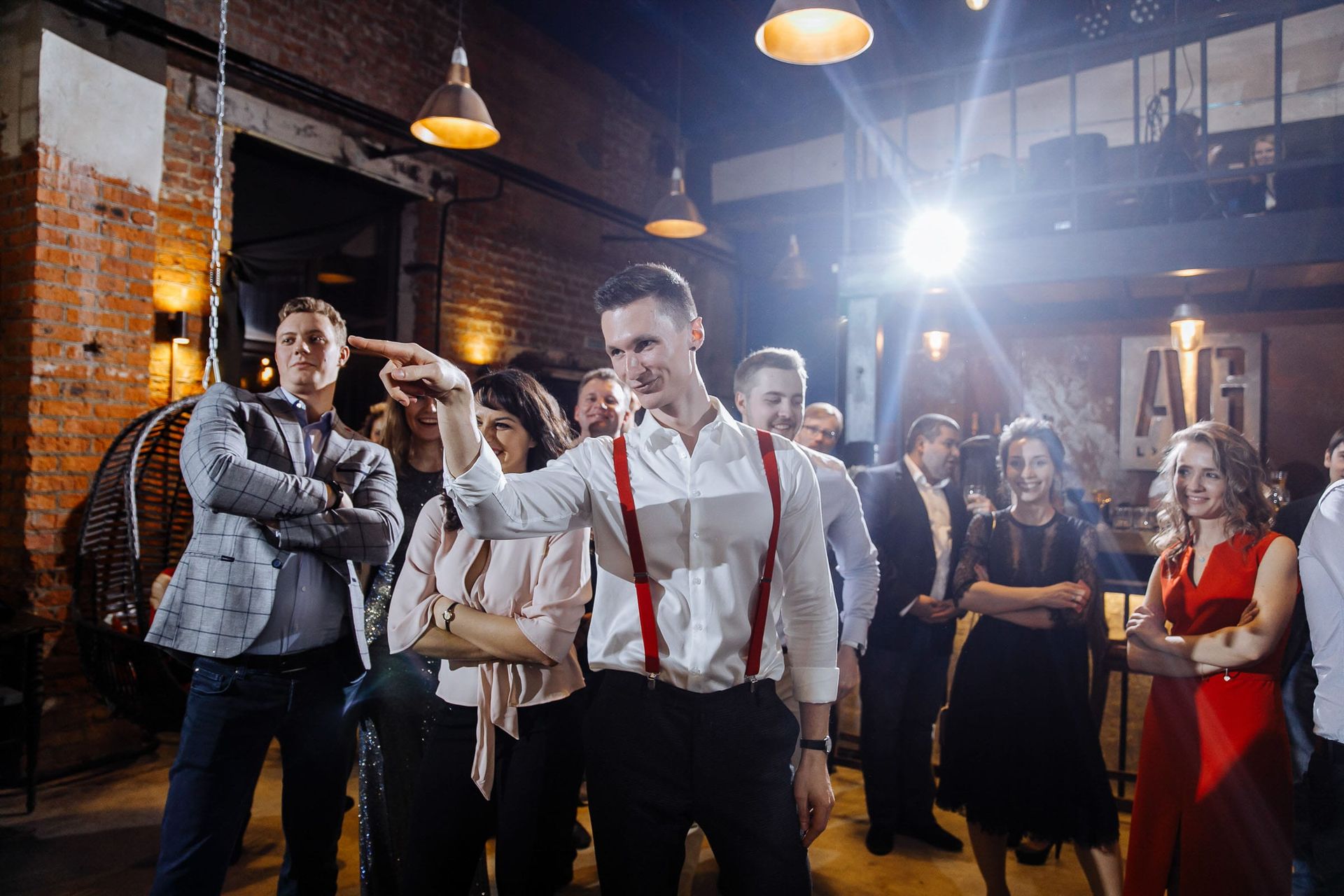 Energetic photo of the groom on the dancefloor from Cornwall wedding photographer Tanya Bogdan.
