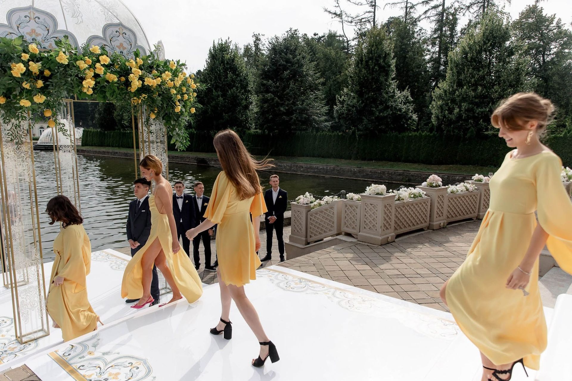 Bridesmaids walking during the ceremony processional at a destination wedding