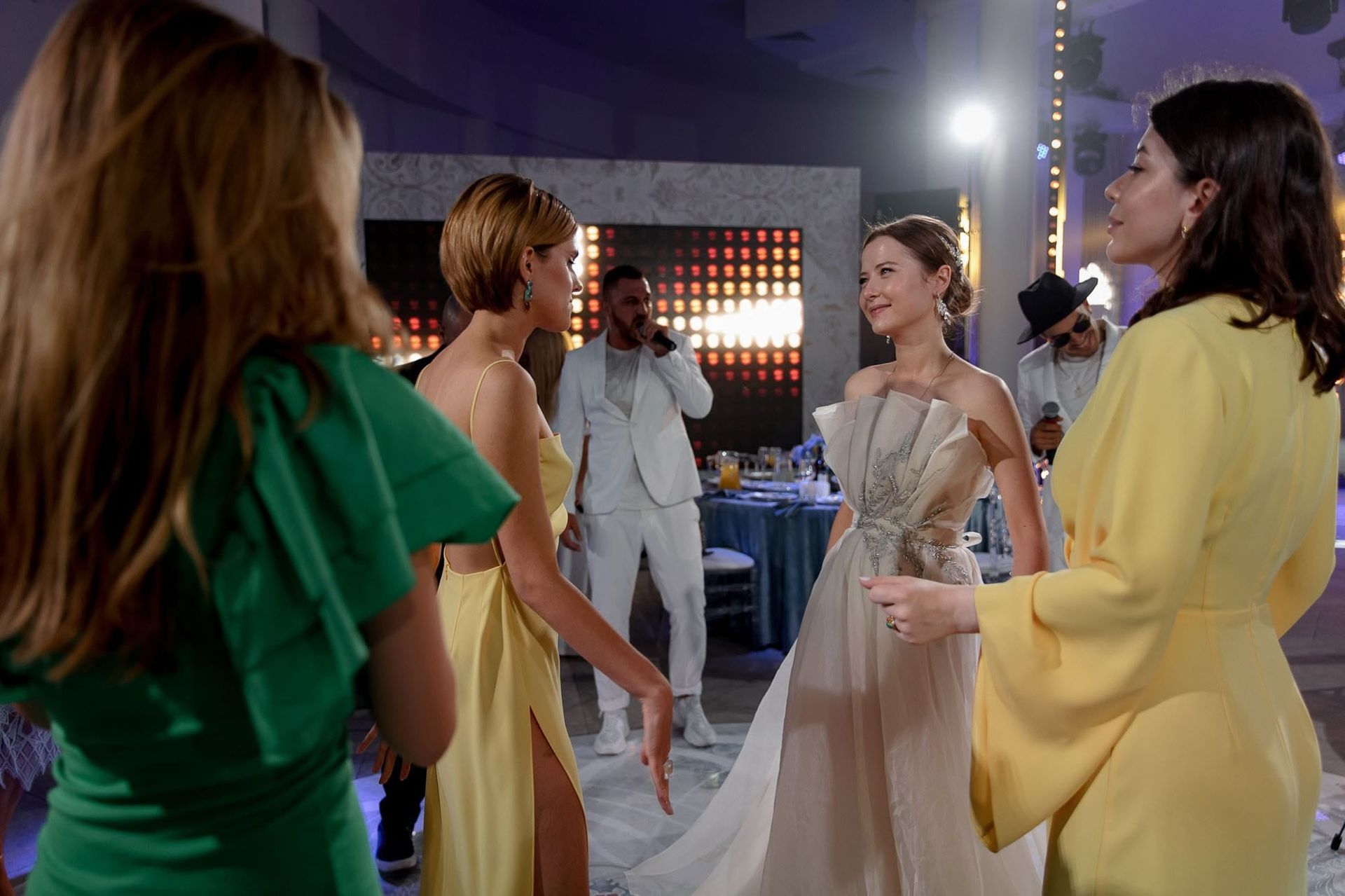 Bride dancing with friends on the reception dancefloor during a destination wedding