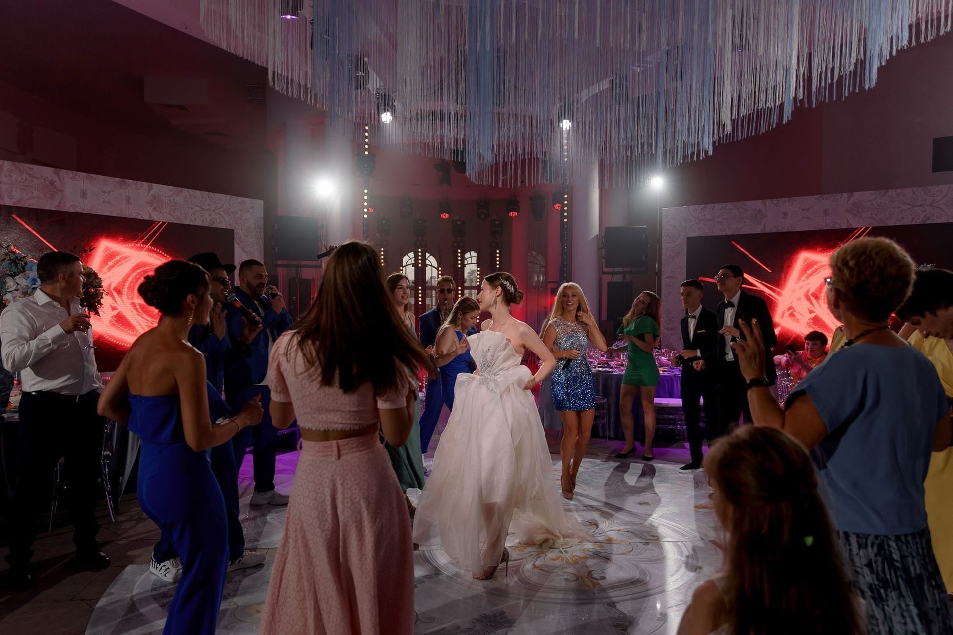 Bride enjoying the dancefloor during a lively destination wedding reception