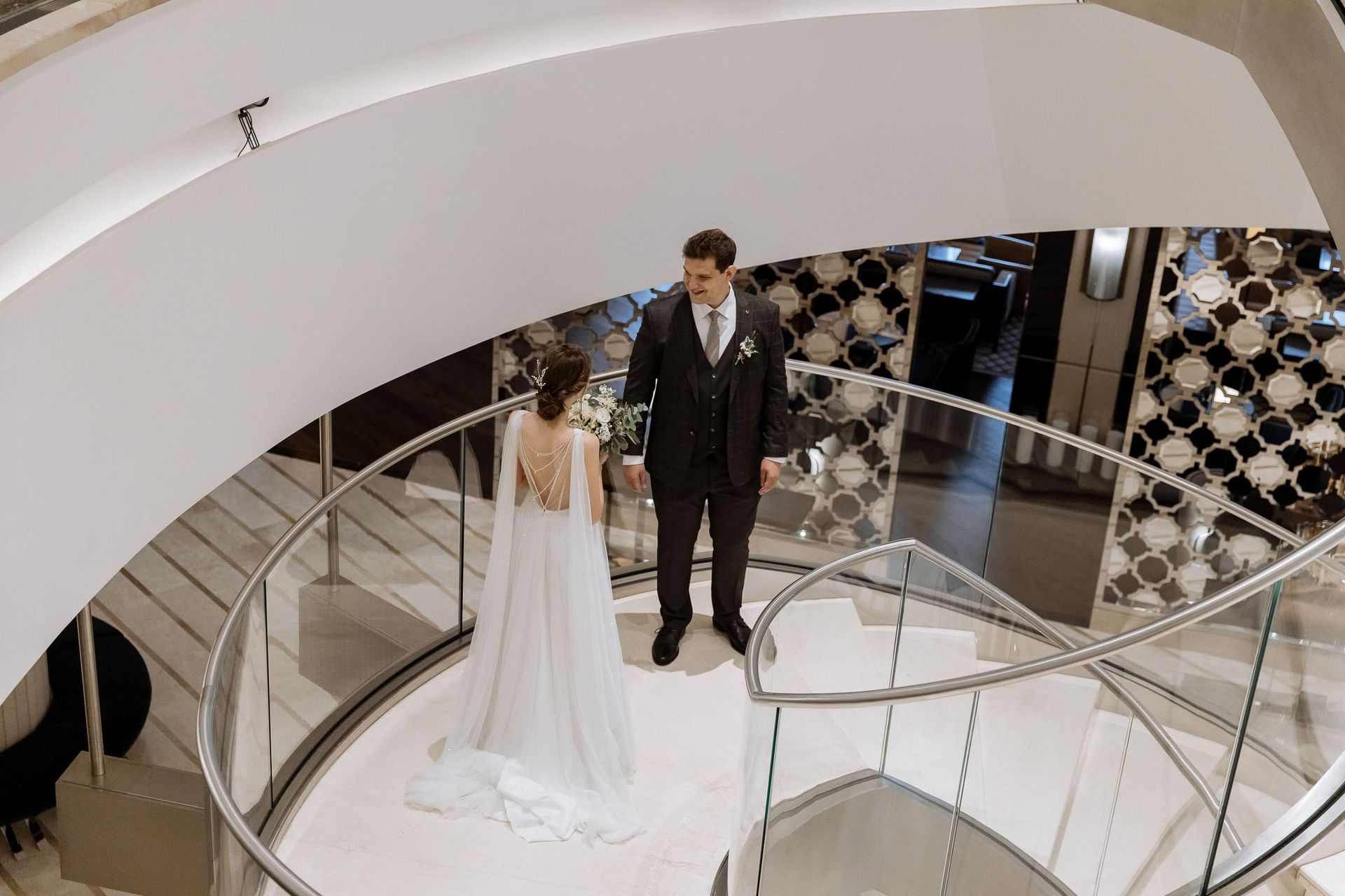 Candid couple moments during a first-look session, captured by a Cornwall wedding photographer.