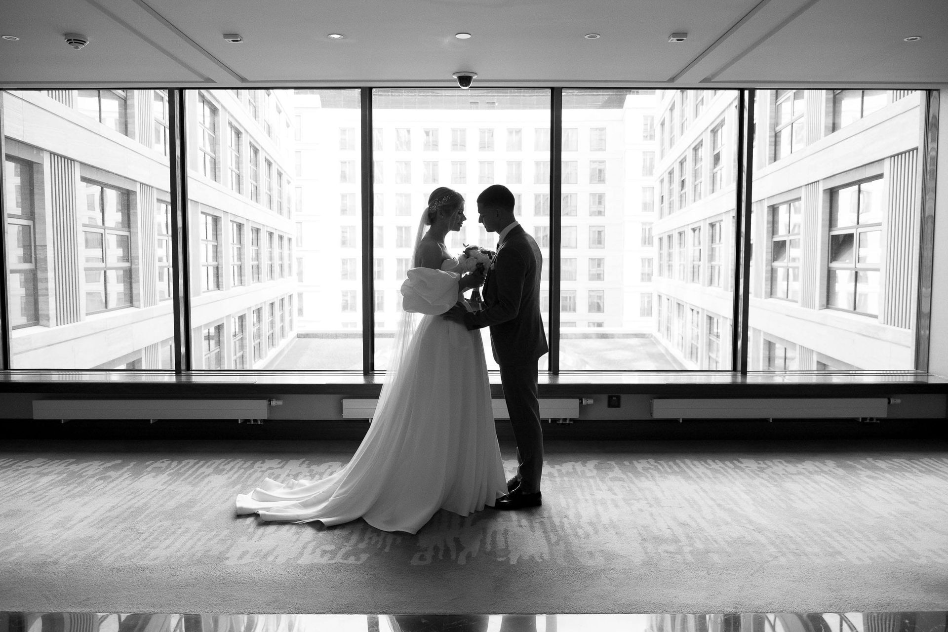 Editorial wedding couple silhouette against a window from London wedding photographer Tanya Bogdan.