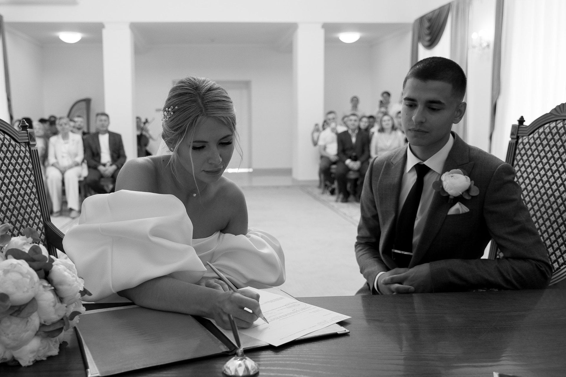 Documentary photography of the couple signing the register from Bude wedding photographer Tanya Bogdan.