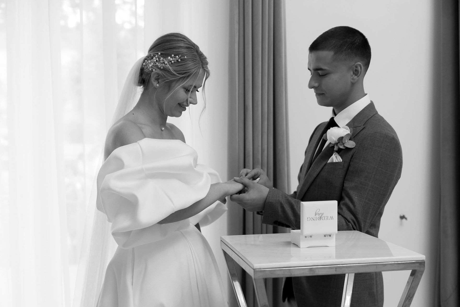 Black and white documentary photography of the wedding ring exchange from Tanya Bogdan.