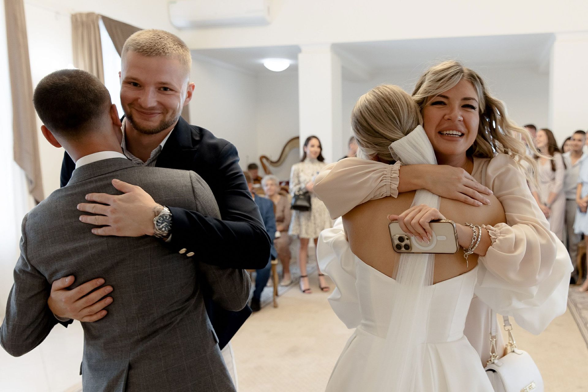 Candid moment of guests congratulating the couple from Devon wedding photographer Tanya Bogdan.