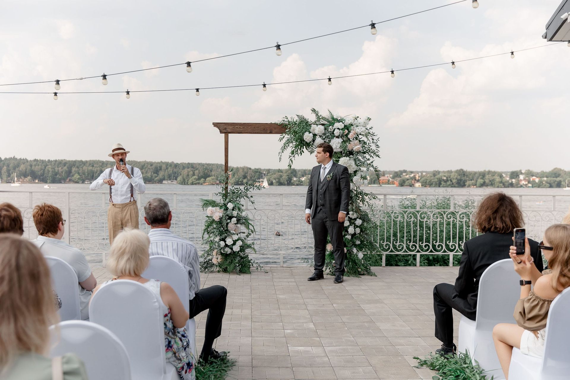 A wide cinematic shot of a wedding ceremony on a harbour bridge by London photographer Tanya Bogdan.