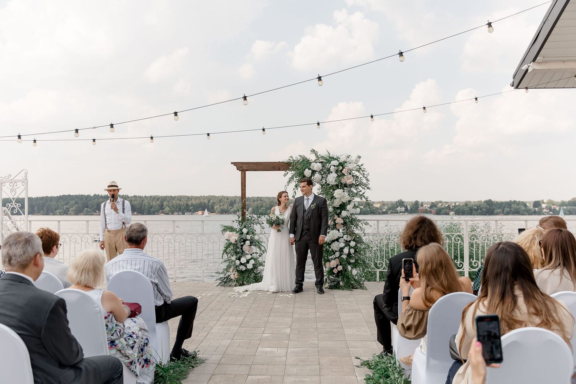 Wide shot of a wedding ceremony in progress by Tanya Bogdan Photography.