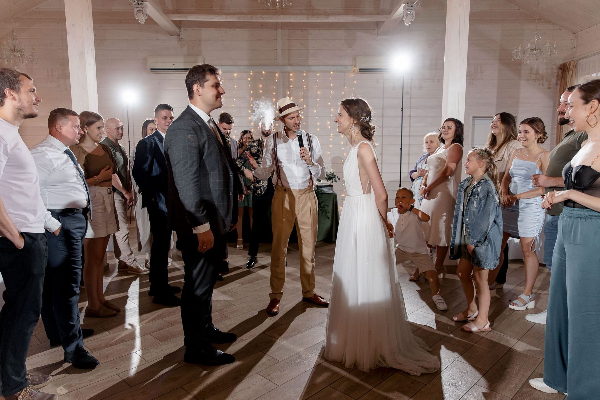 An action shot of wedding guests on the dancefloor by a South West wedding photographer.