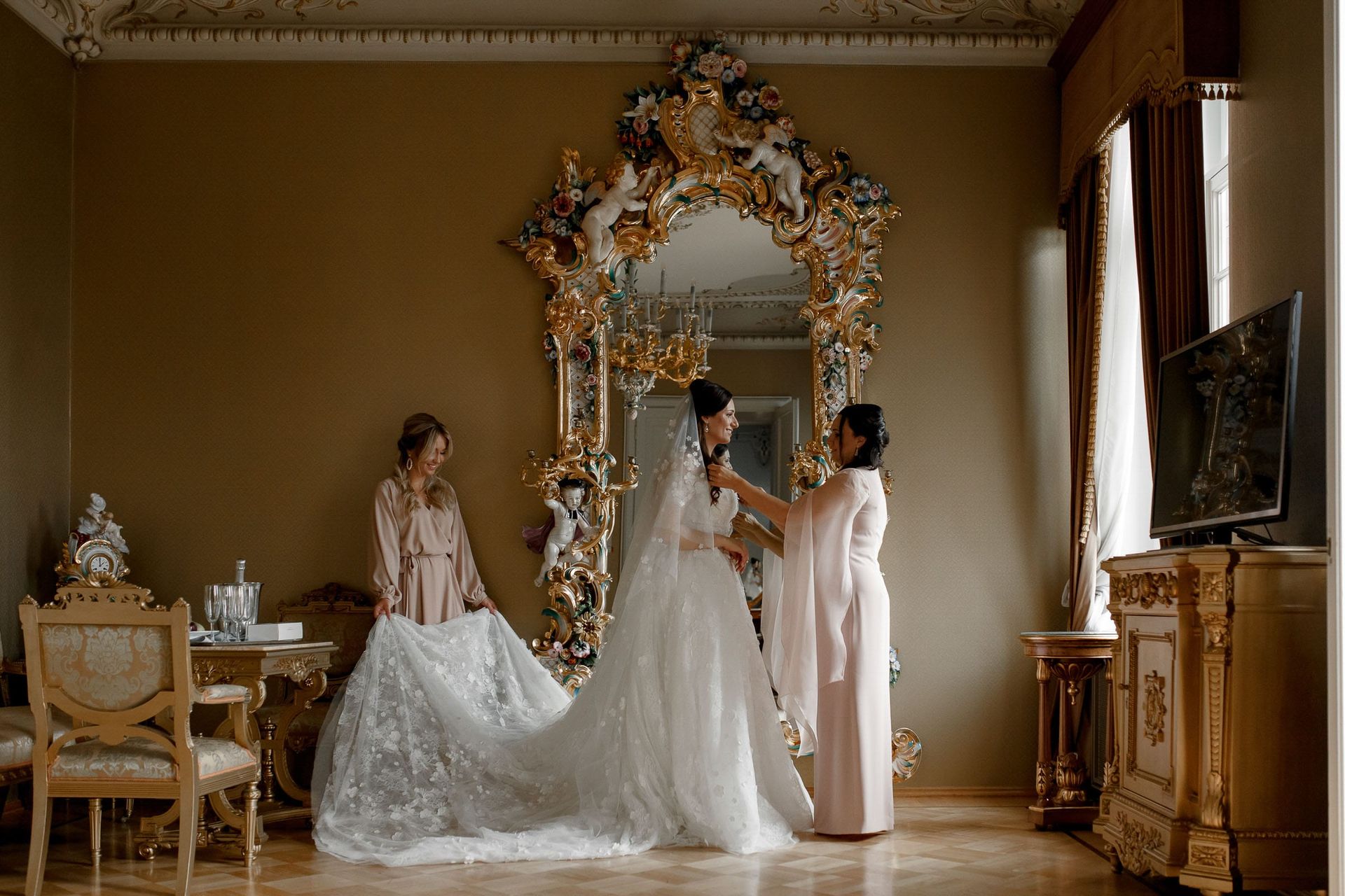 Editorial photography of bridesmaids reflected in a grand mirror by Tanya Bogdan, serving Devon and London.