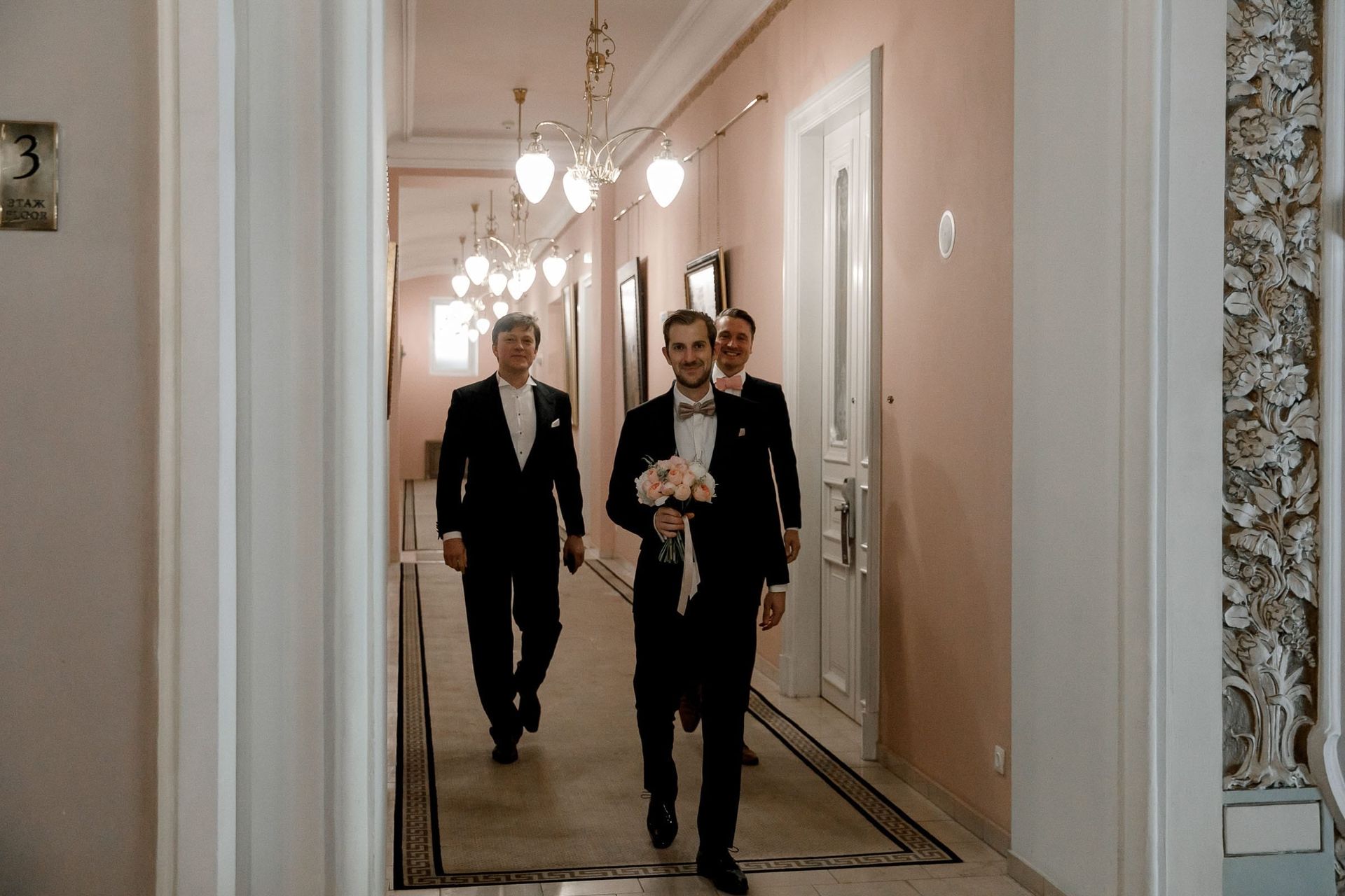 Candid photography of a groom walking to a first look by Tanya Bogdan, an editorial photographer serving the Cotswolds.