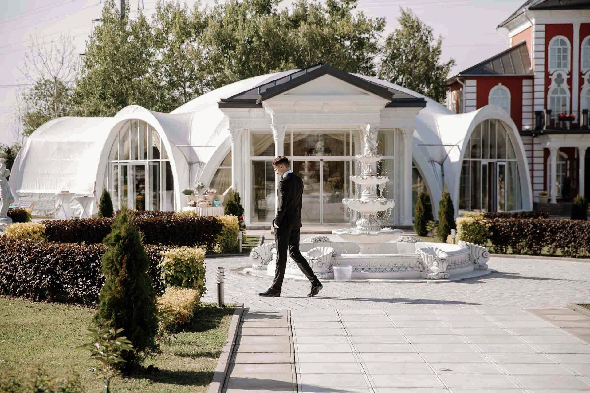 Candid documentary moment of the groom at a luxury outdoor ceremony by Tanya Bogdan.