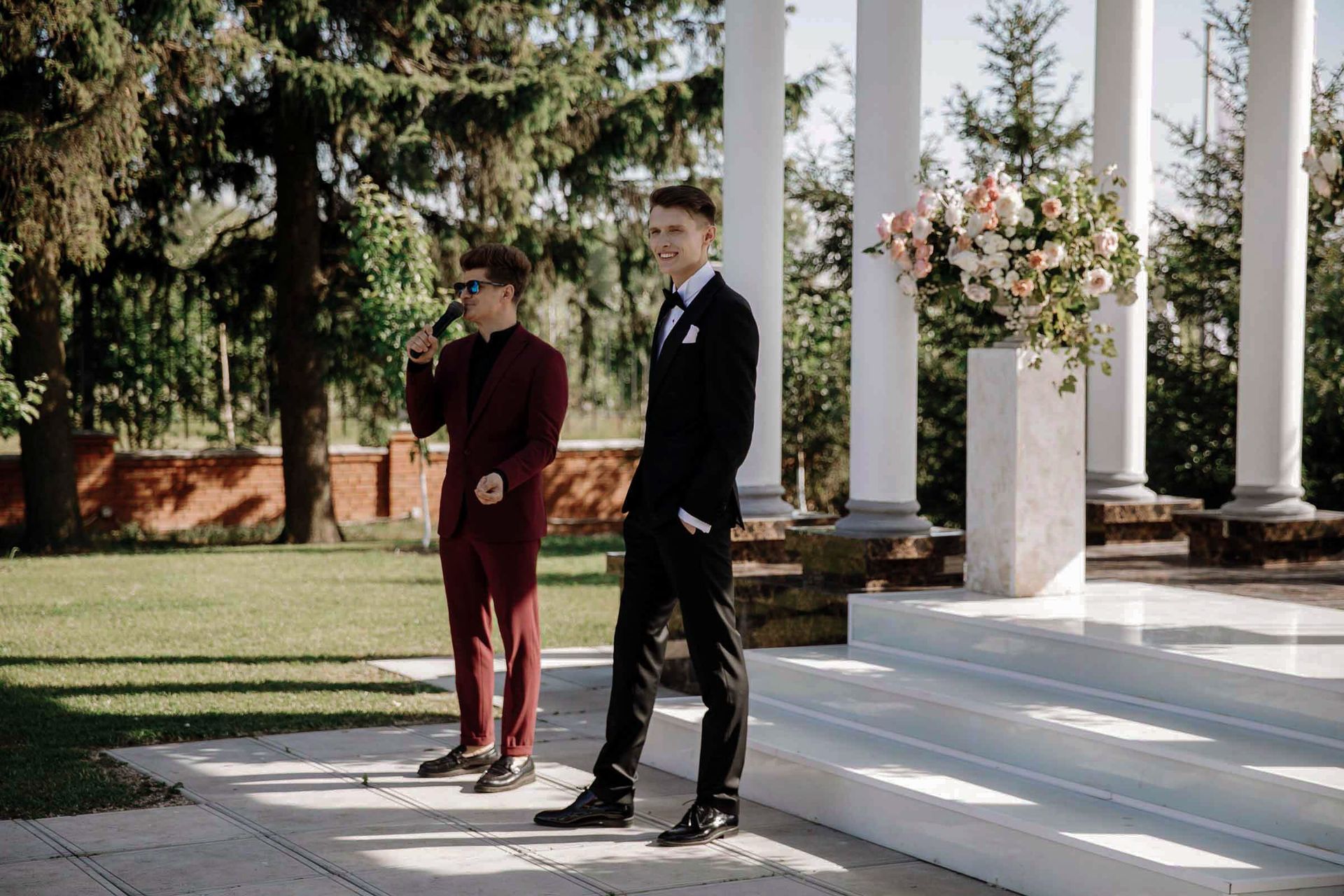 A documentary shot of the groom at a grand outdoor venue by Tanya Bogdan.