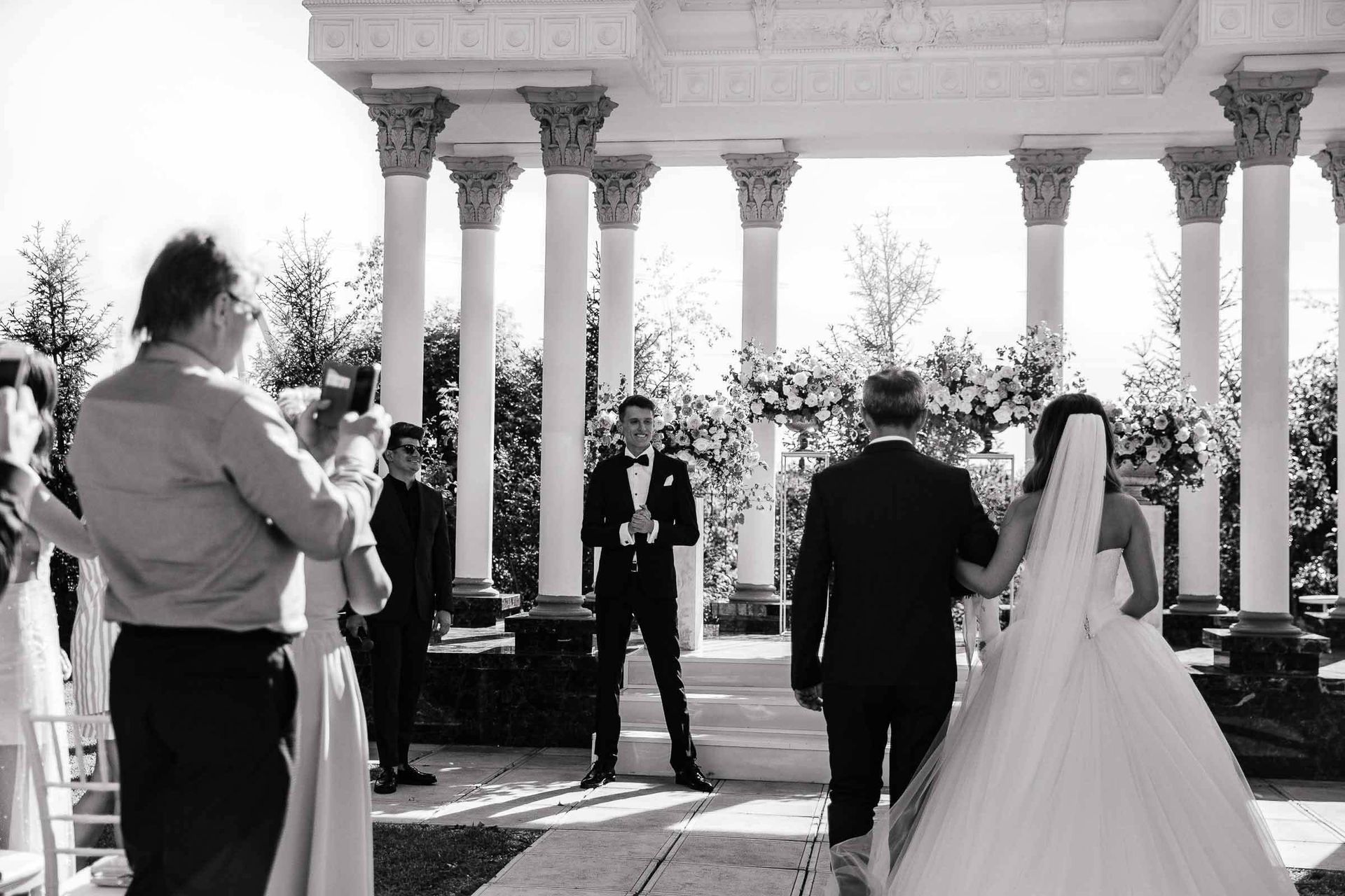 A grand, wide-angle editorial photograph of an outdoor ceremony by London photographer Tanya Bogdan.