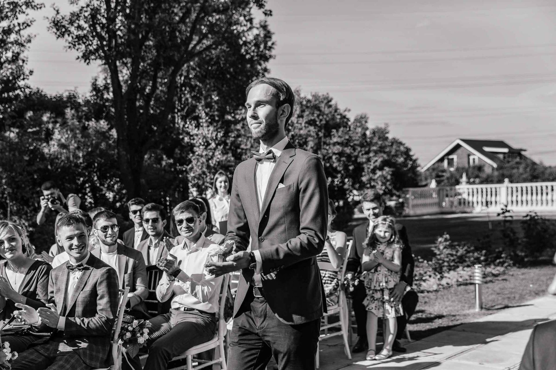 A charming black and white candid shot of the ring bearer by Tanya Bogdan.