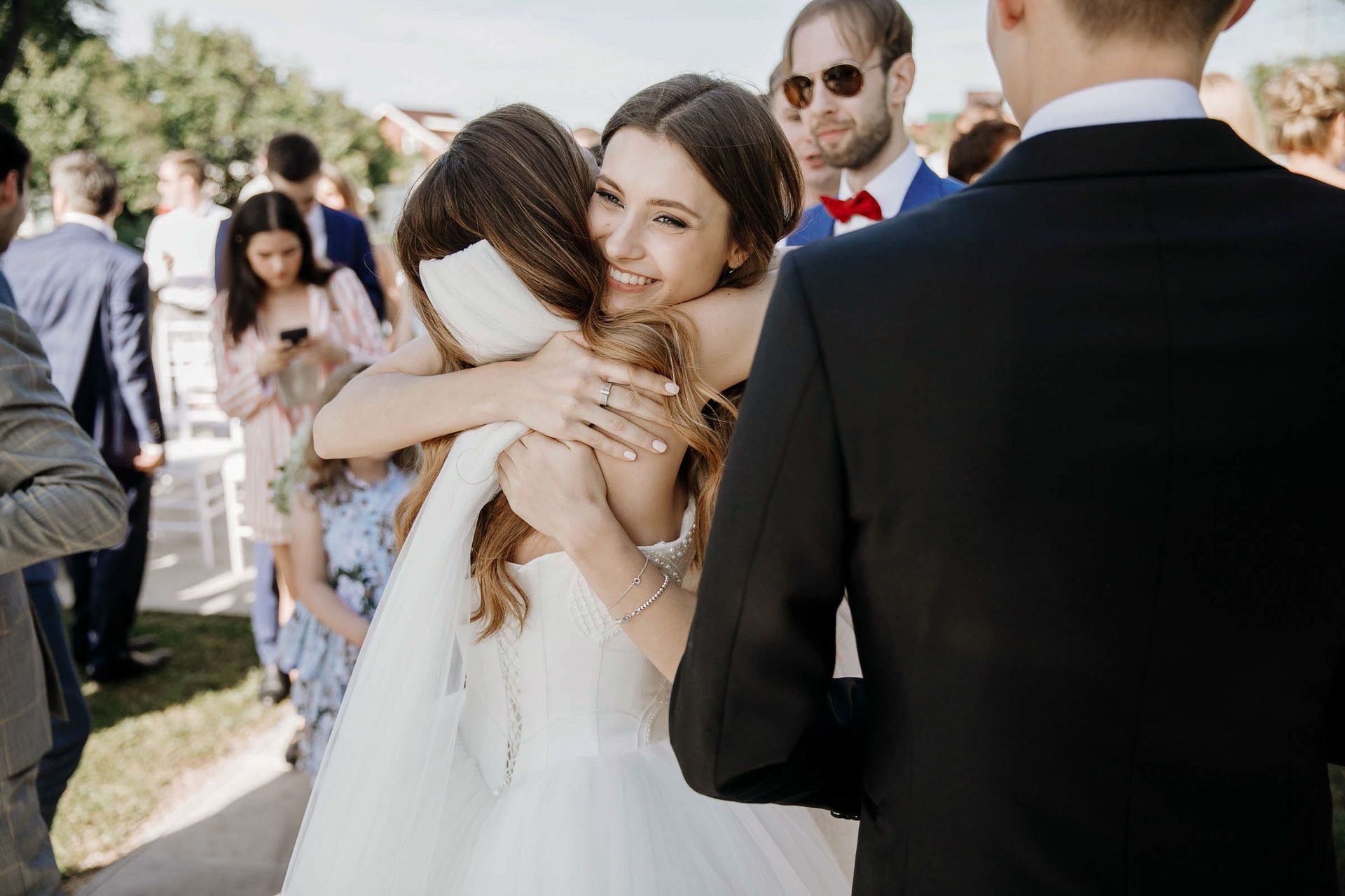 A candid hug captured by London documentary wedding photographer Tanya Bogdan.