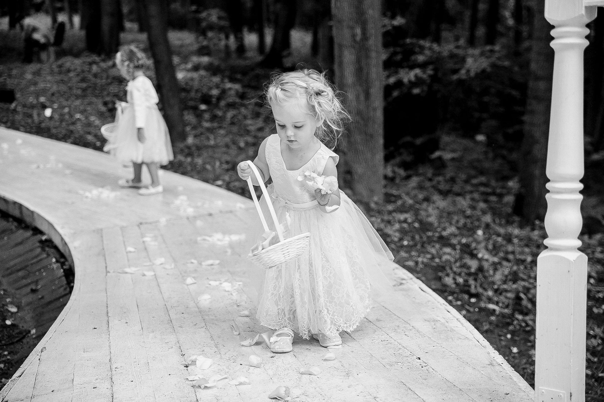 Candid documentary moment of children throwing petals by Tanya Bogdan, serving Bude and Devon.