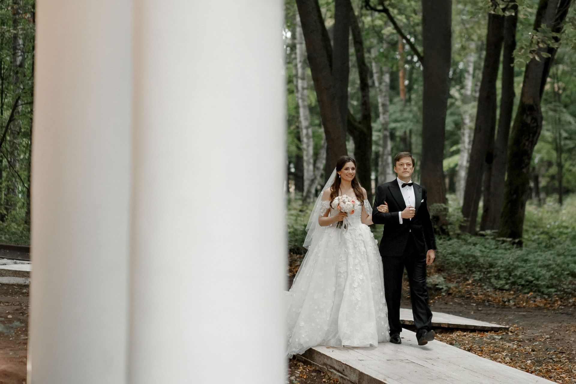 An emotional documentary moment of a father walking his daughter down the aisle by Tanya Bogdan.