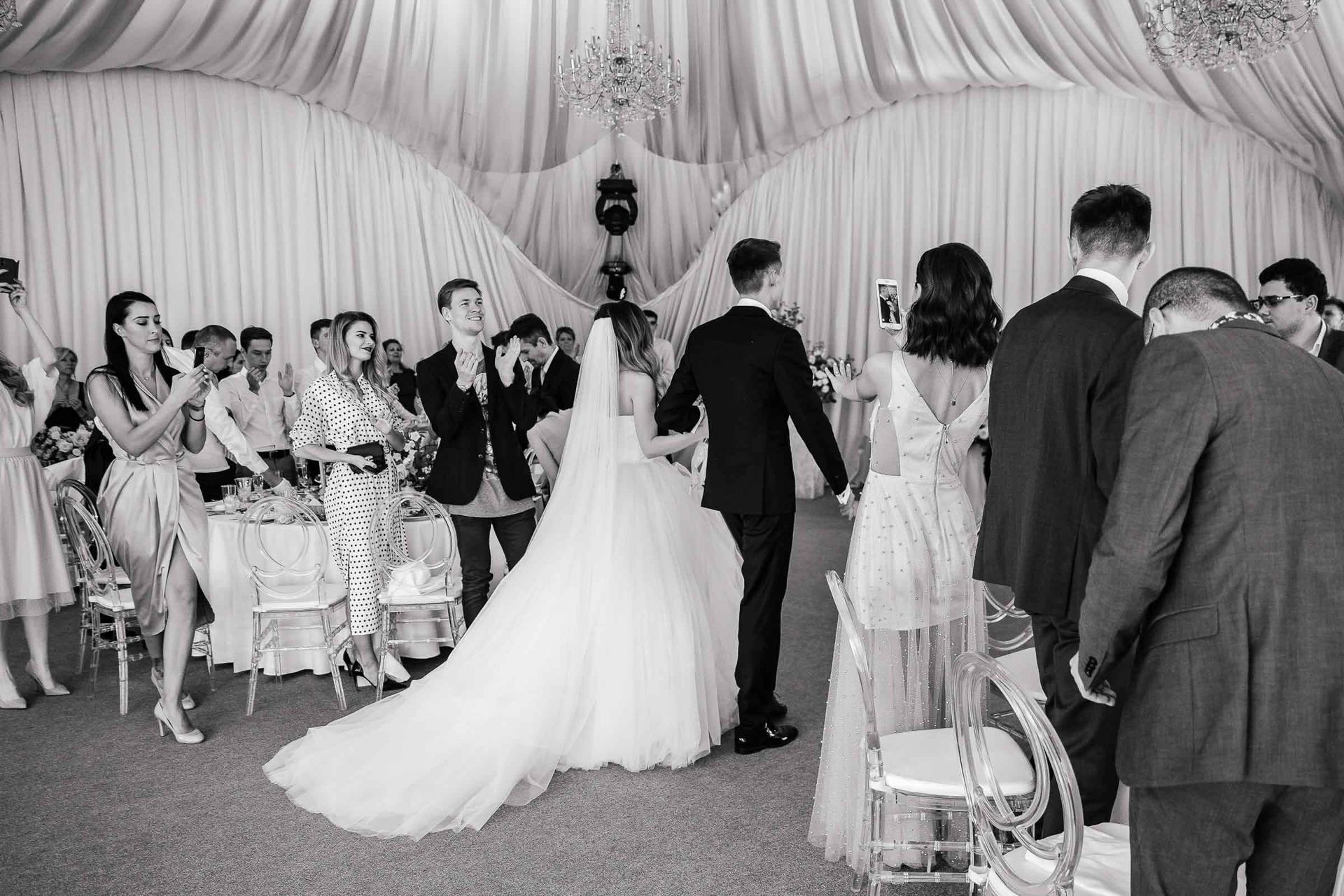 Dynamic black and white documentary photography of the reception entrance by Tanya Bogdan.