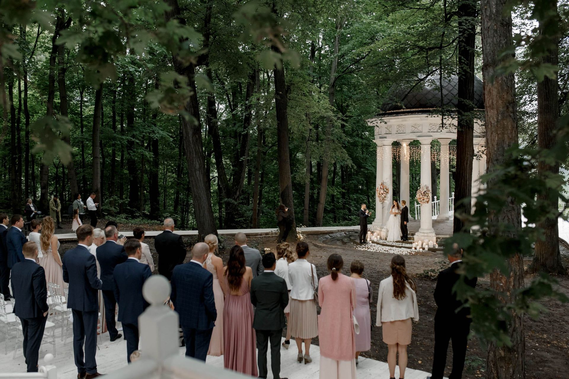 A grand wide-angle documentary shot of an outdoor ceremony by Tanya Bogdan, serving Devon and Bude.